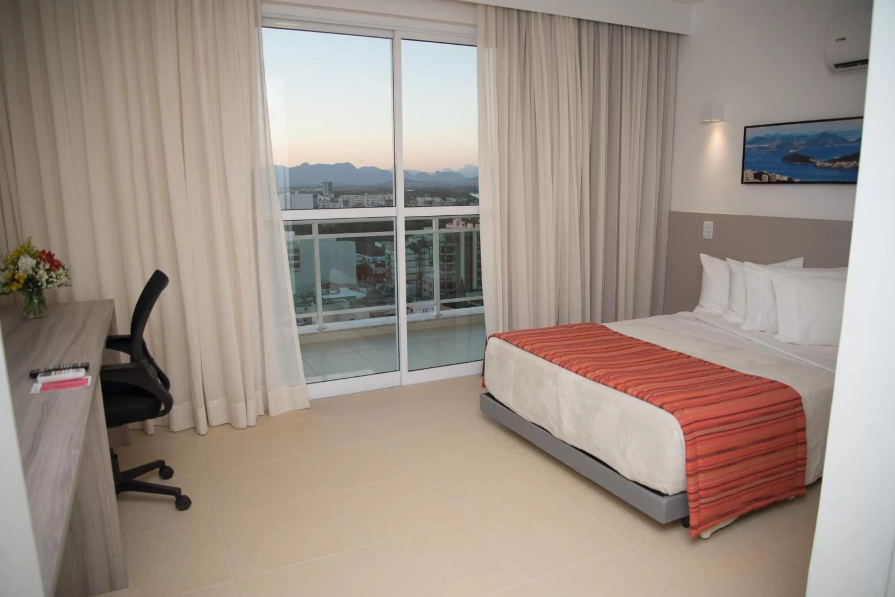 Bed in Ramada by Wyndham Macae Hotel & Suites