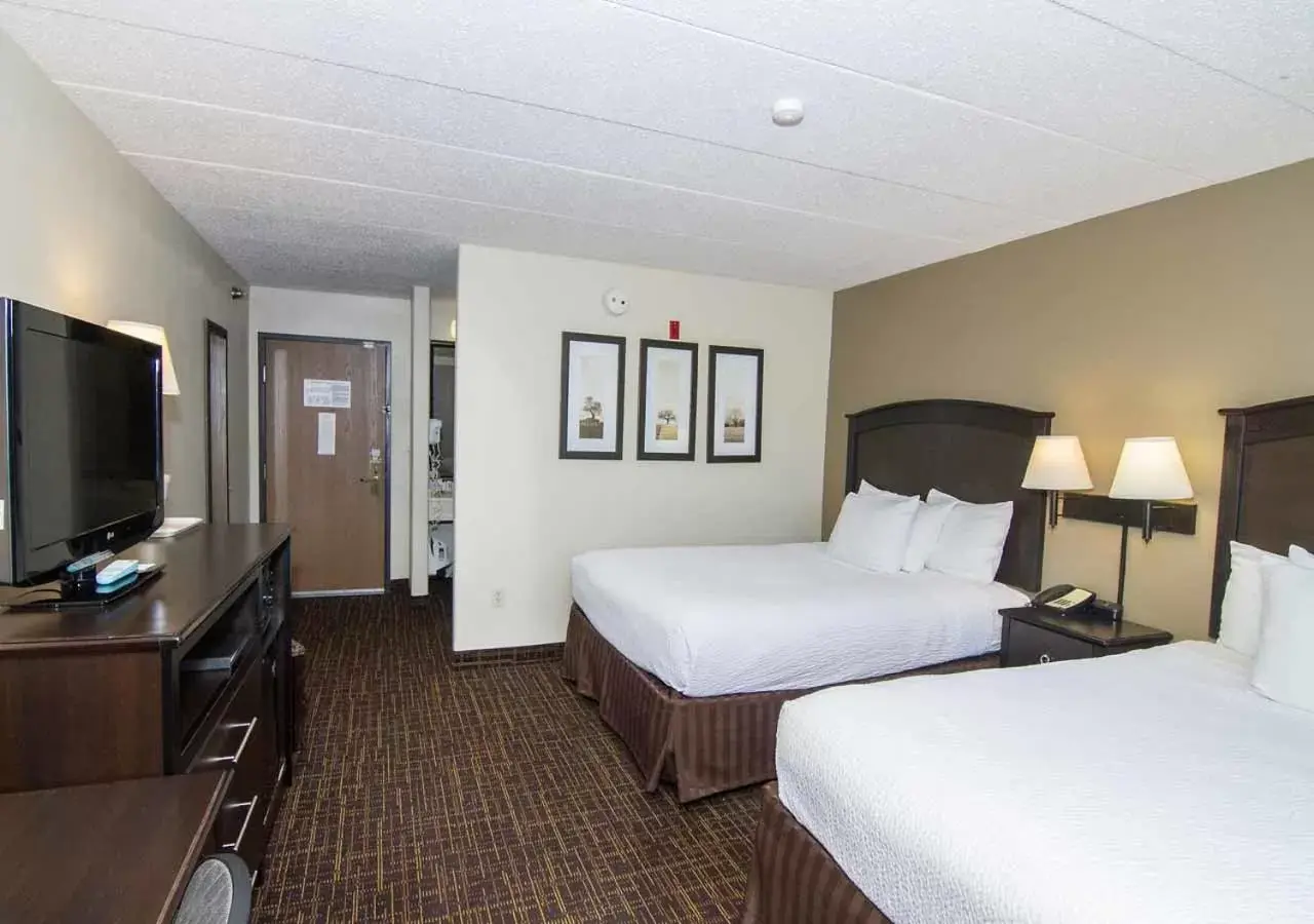 Bed in AmericInn by Wyndham Peoria