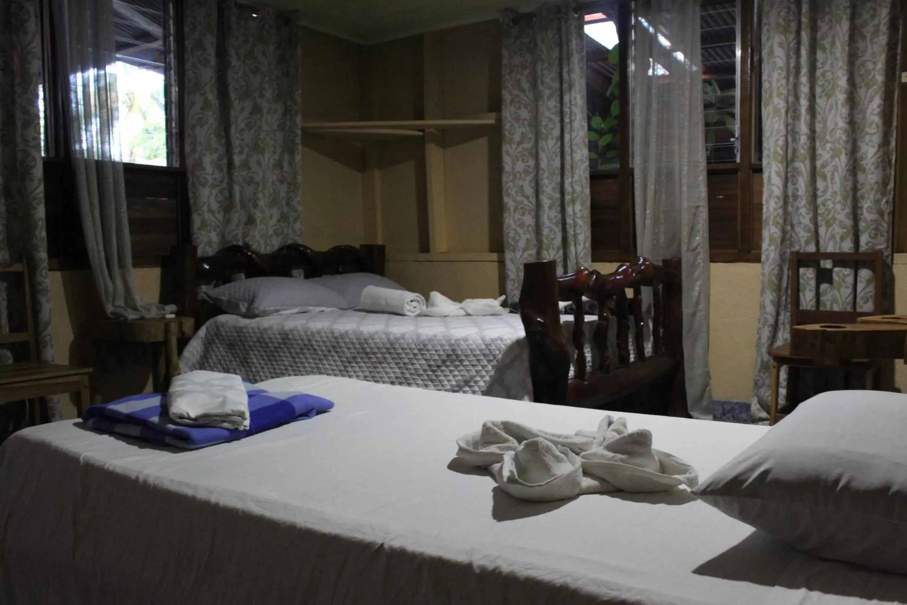 Bed in Iguanitas Lodge