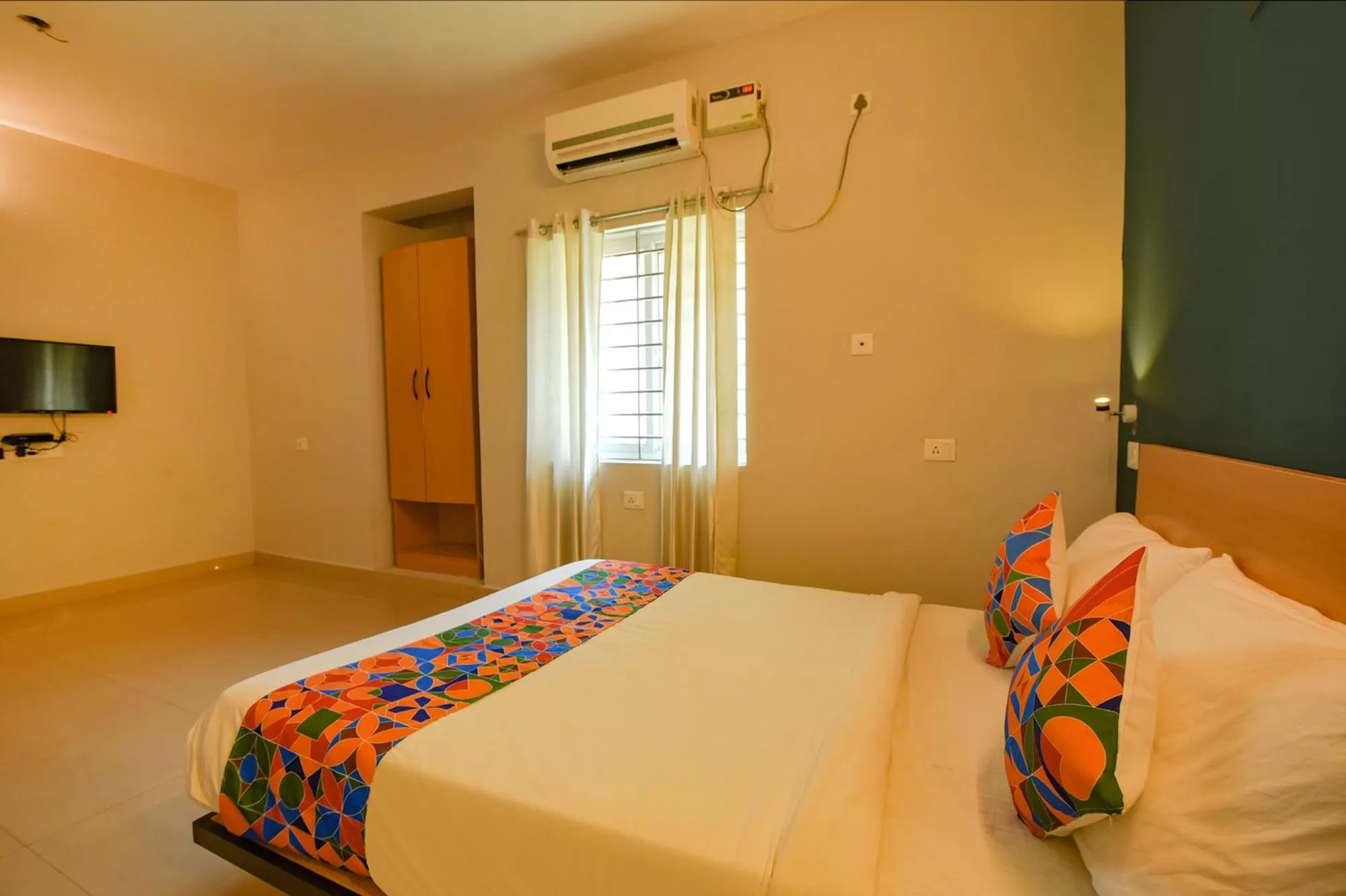 Bed in FabHotel Sasti Inn