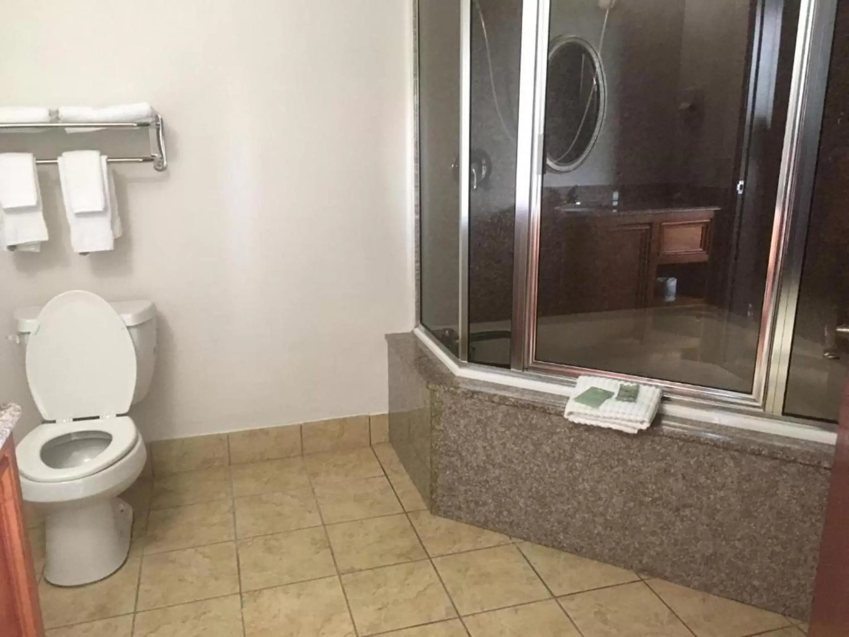 Toilet, Bathroom in Heritage Inn and Suites