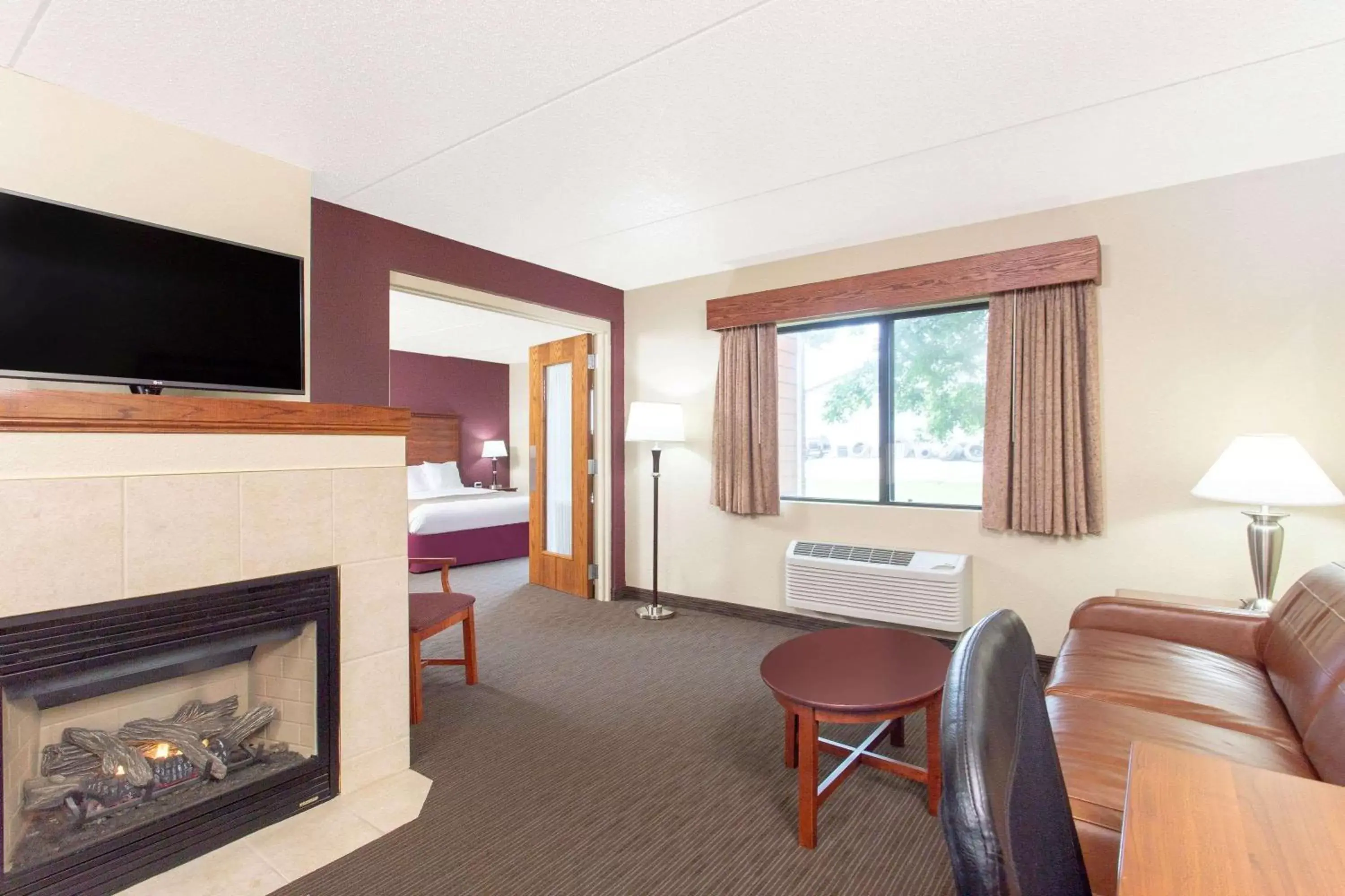Photo of the whole room, TV/Entertainment Center in AmericInn by Wyndham New London