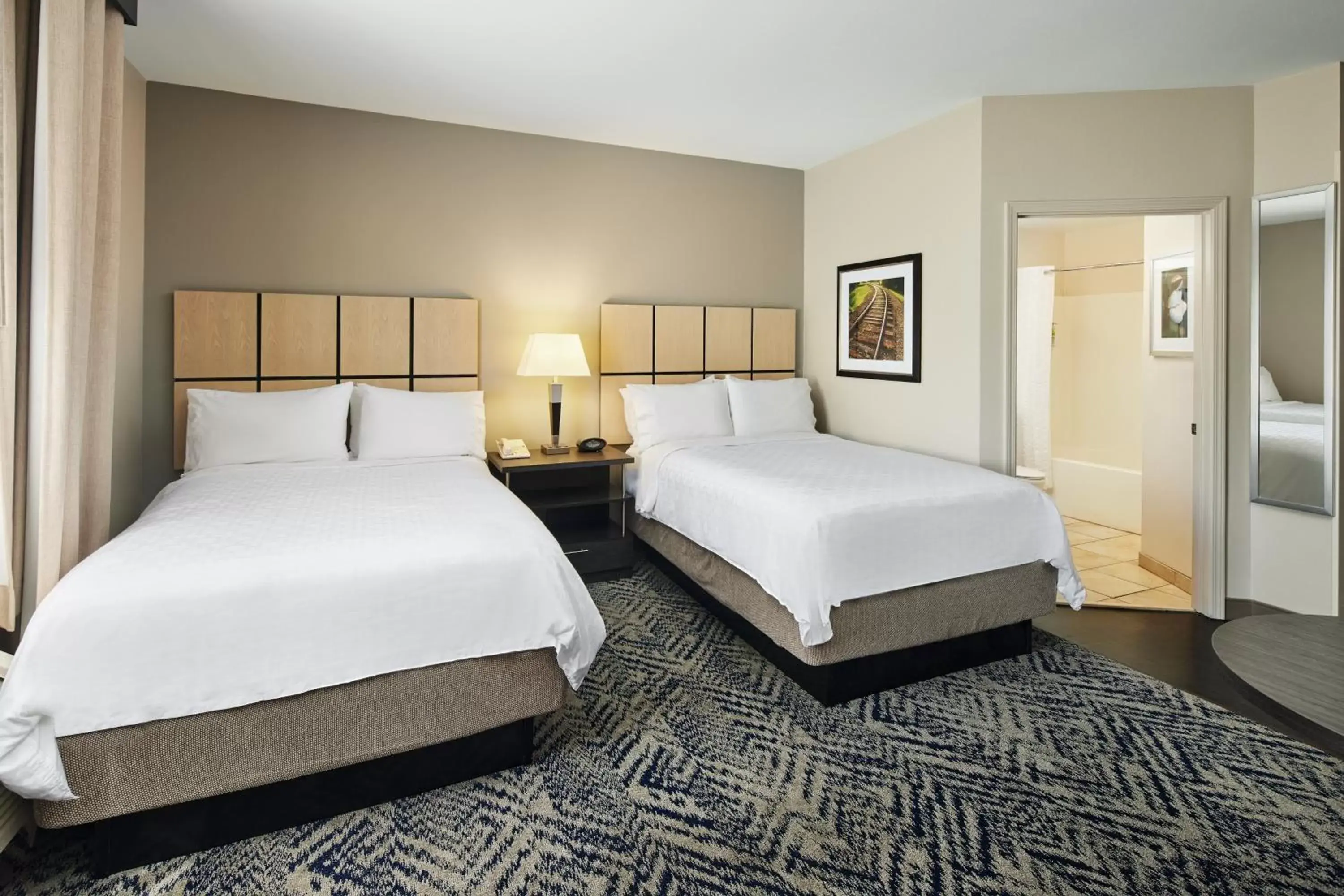 Photo of the whole room, Bed in Candlewood Suites I-26 @ Northwoods Mall, an IHG Hotel