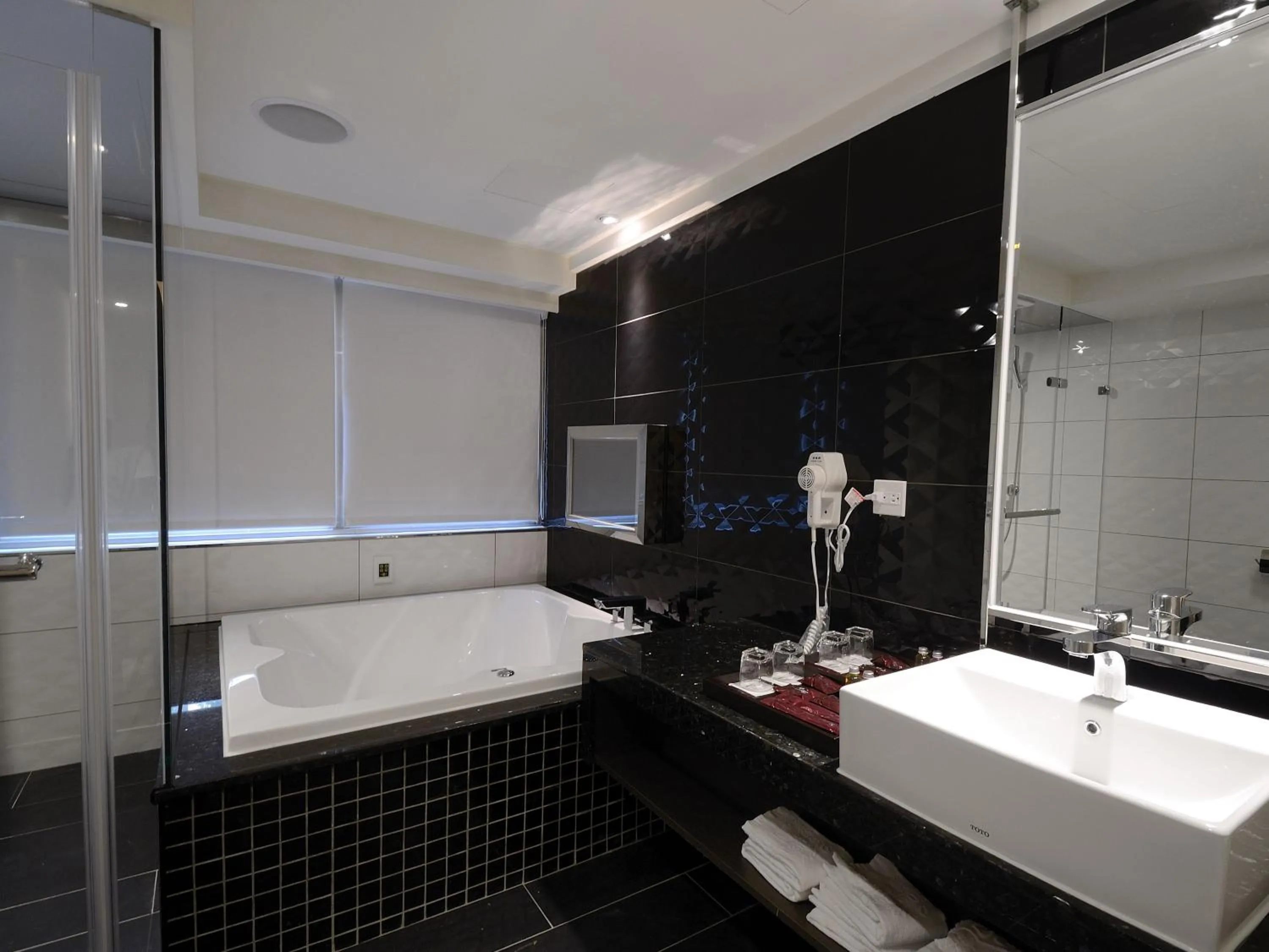 Bathroom in V-one Vogue Hotel