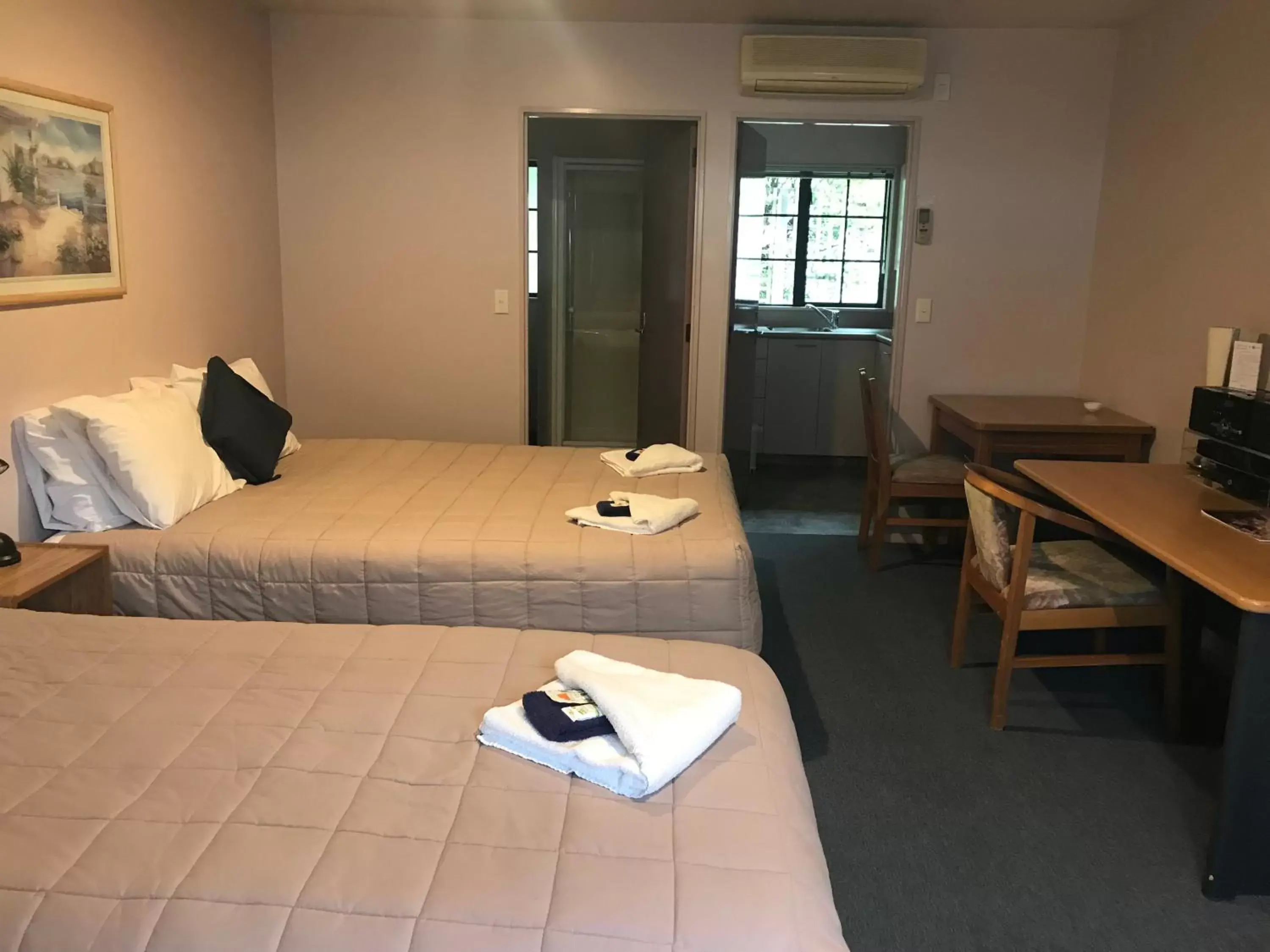 Bed in Tudor Lodge Motel