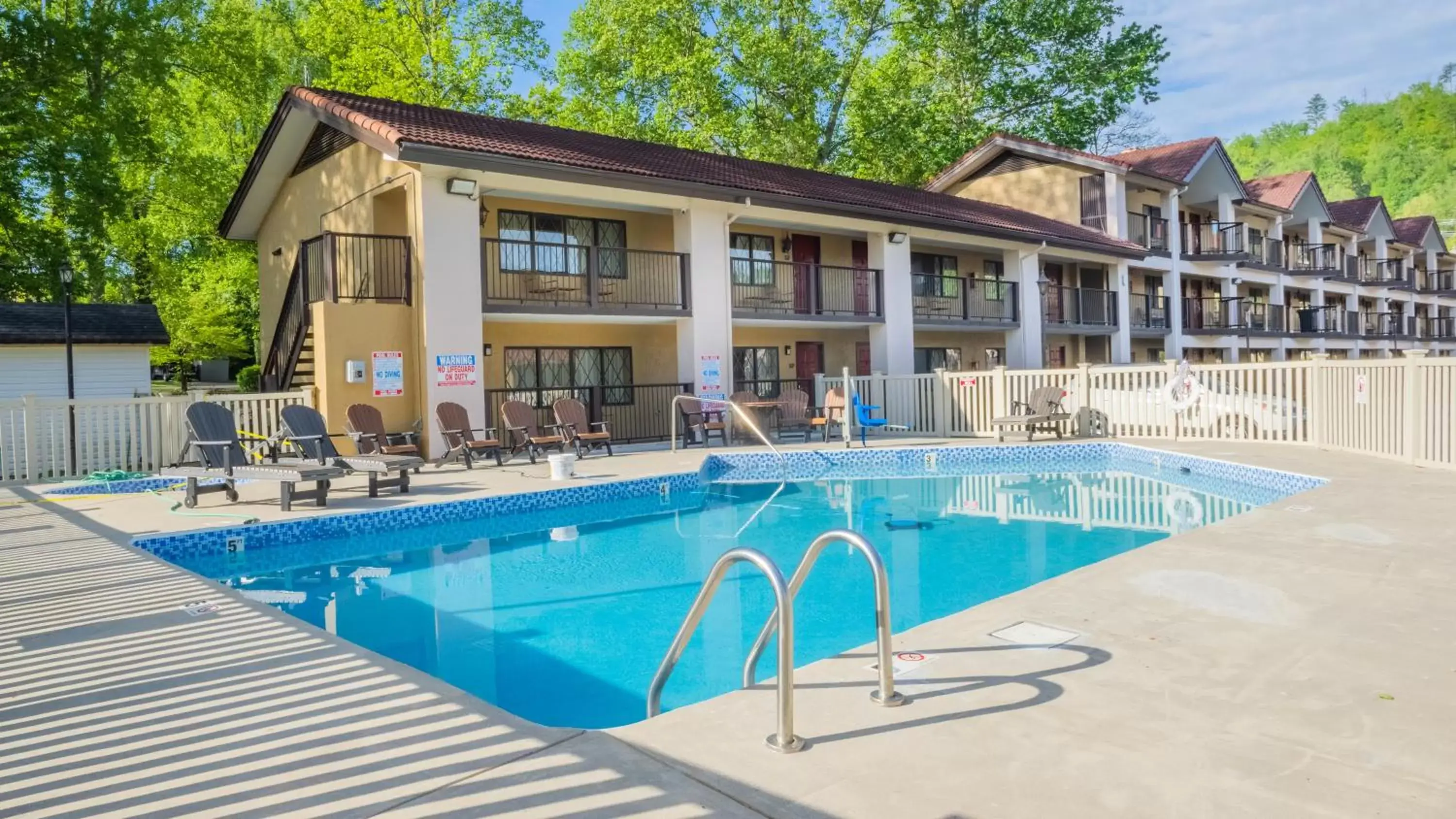 Swimming pool, Property Building in Super 8 by Wyndham Downtown Gatlinburg at Convention Center