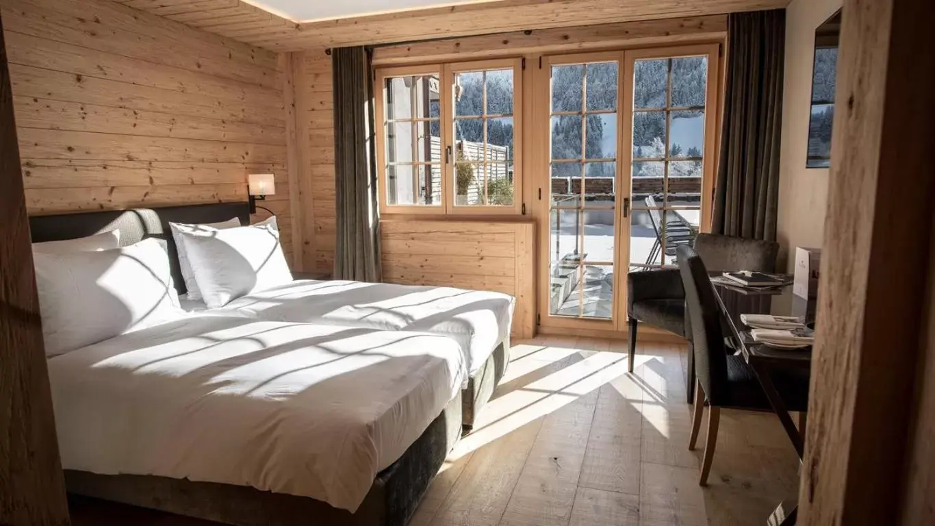 Bedroom, Bed in Hôtel de Rougemont & Spa