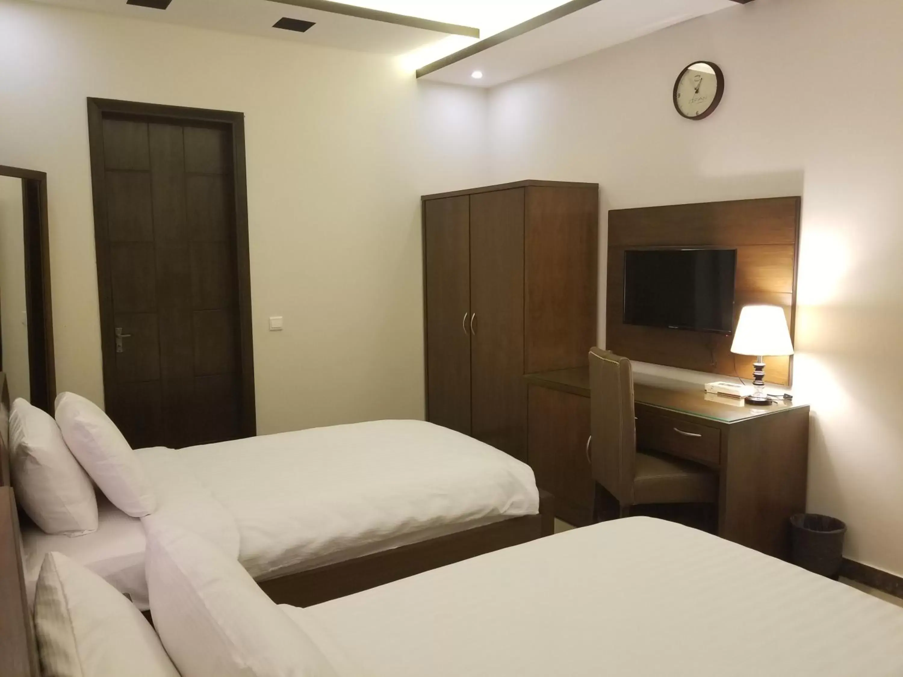 Bed in Zifan Hotel & Suites