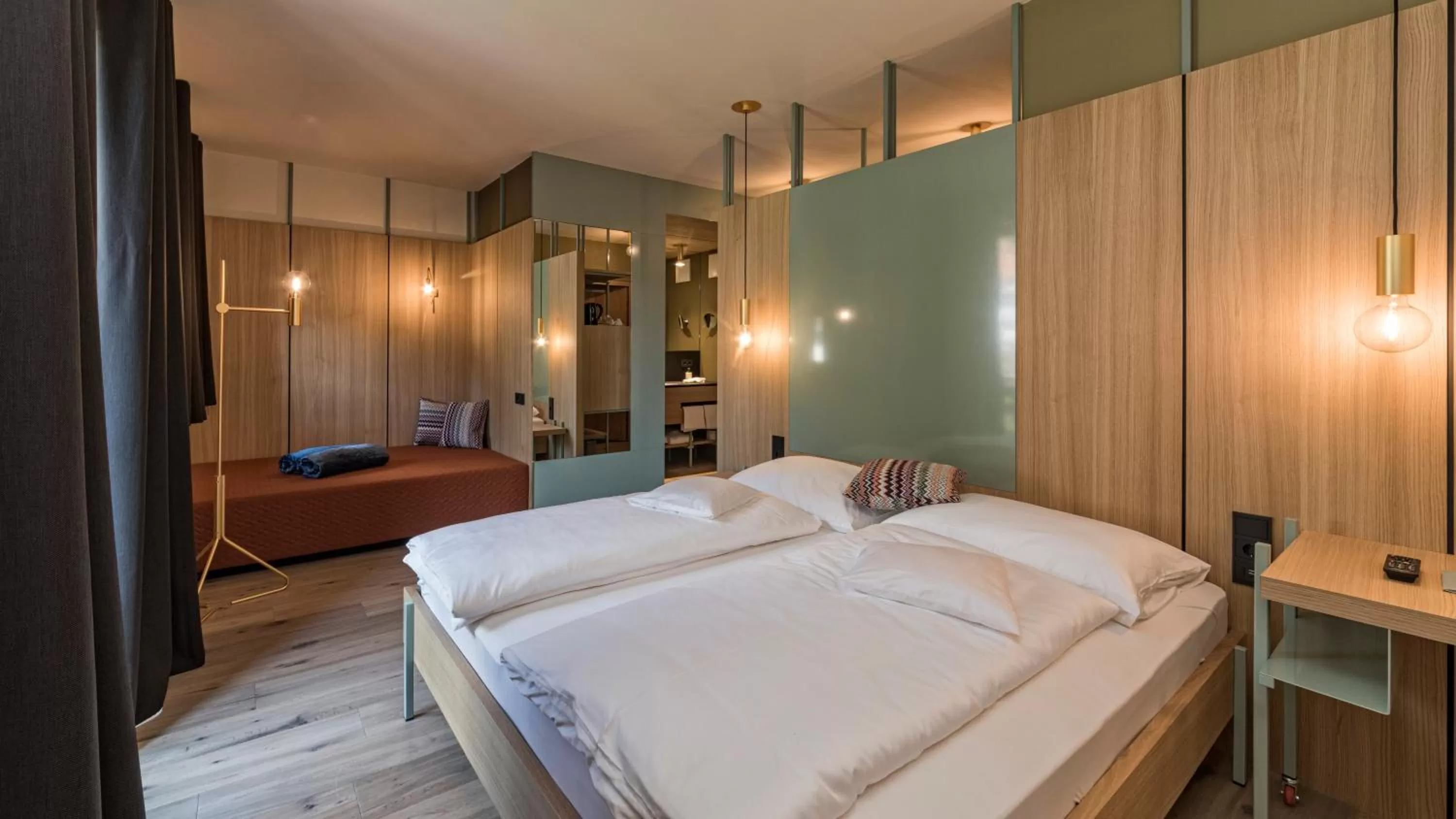 Bed in Hotel Villa Mayr Rooms & Suites