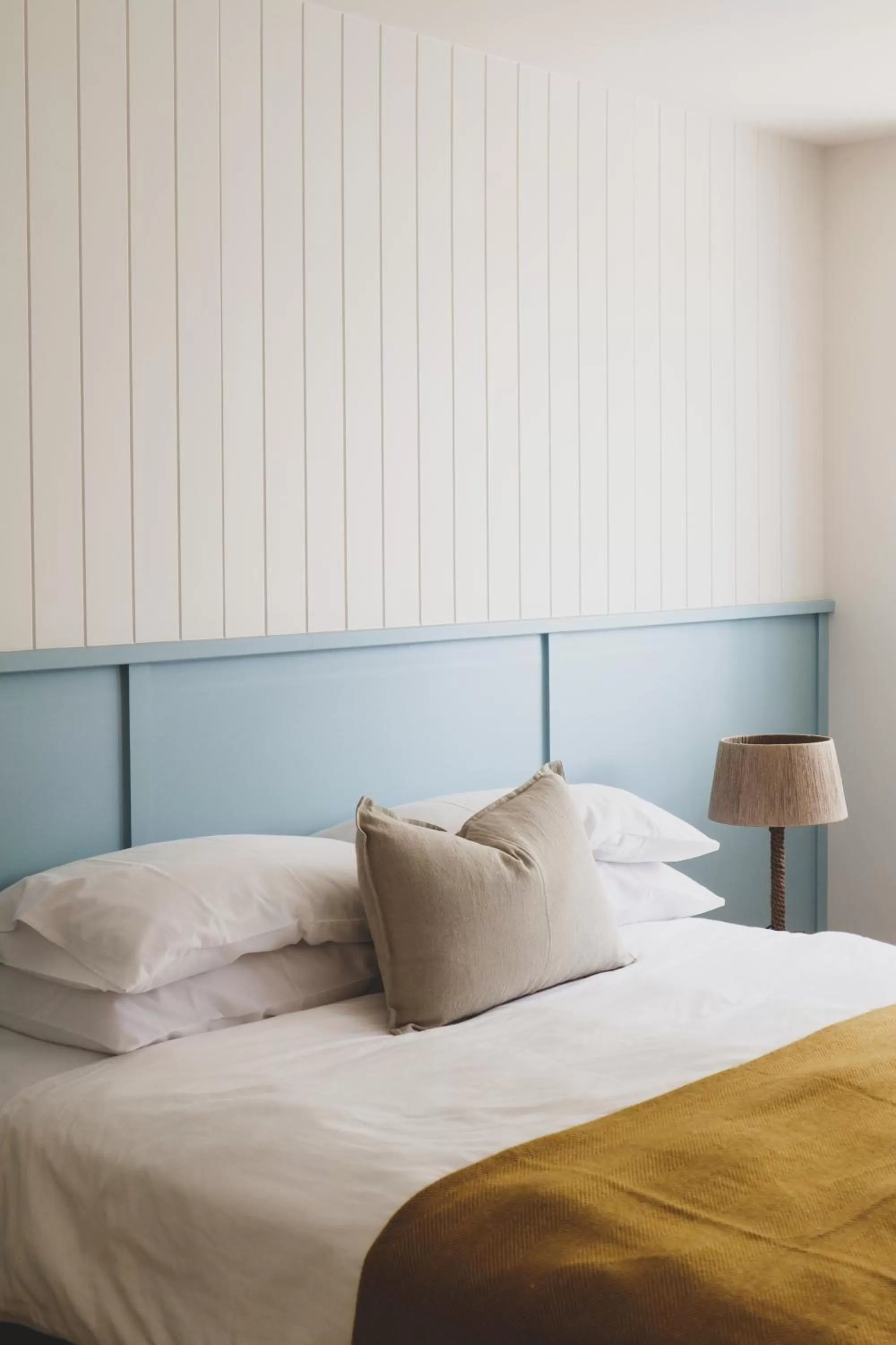 Bed in The Blue Water Motel