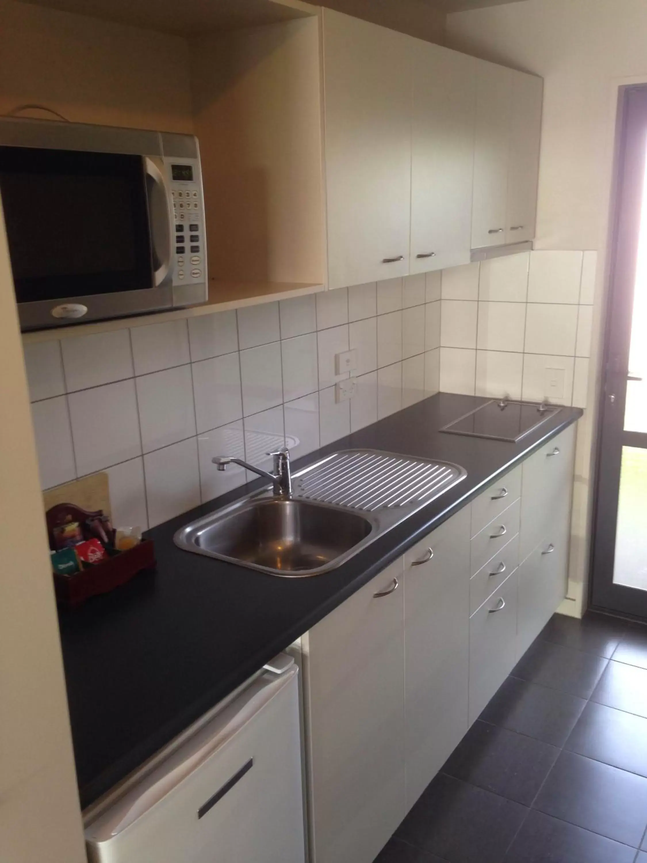 Kitchen/Kitchenette in Azena Suites & Apartment