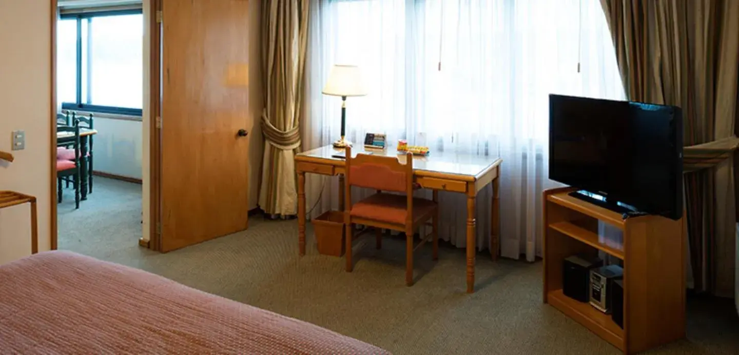 TV and multimedia, TV/Entertainment Center in abba Presidente Suites Puerto Montt