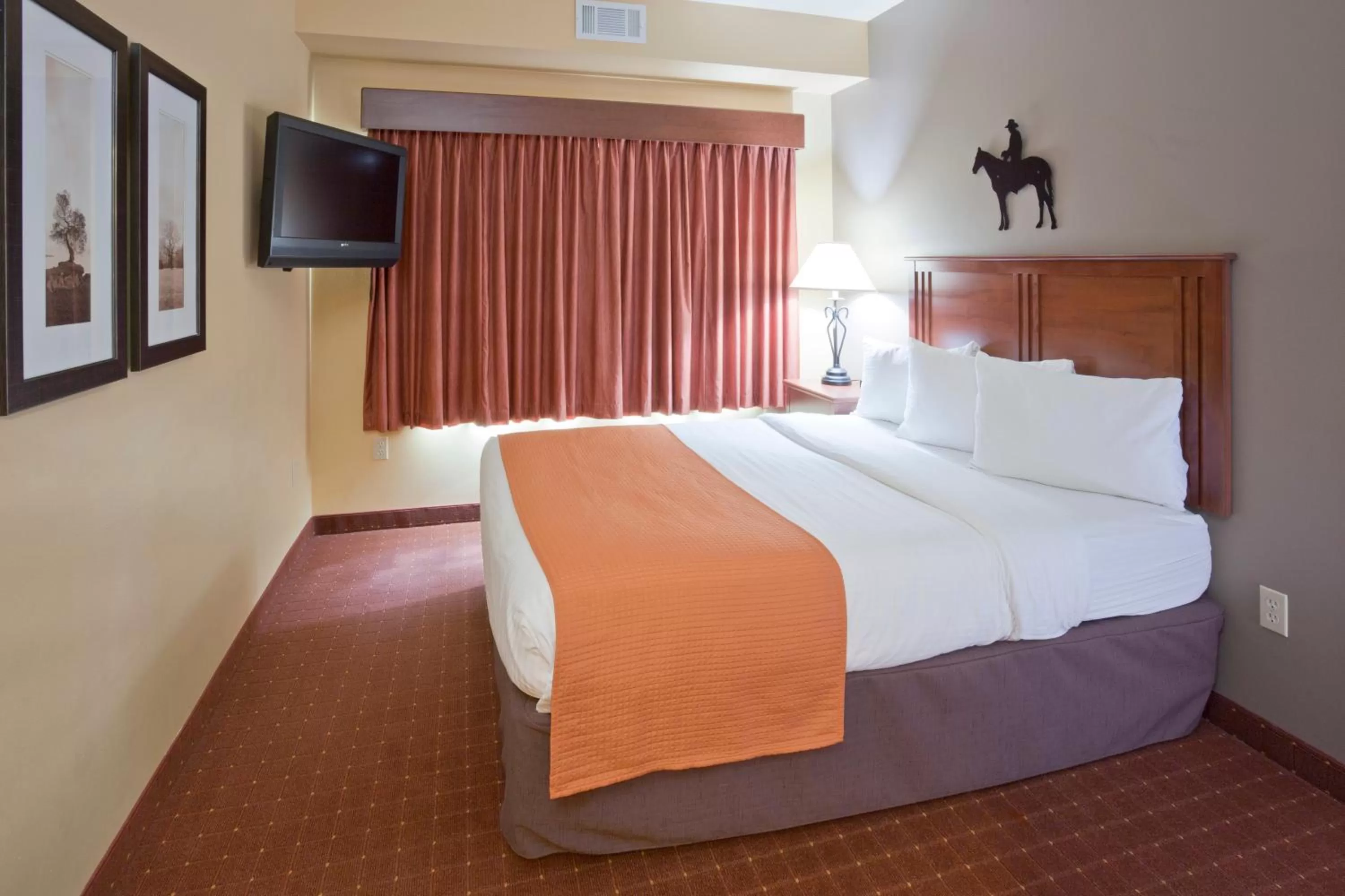 Bed in AmericInn by Wyndham Fargo Medical Center