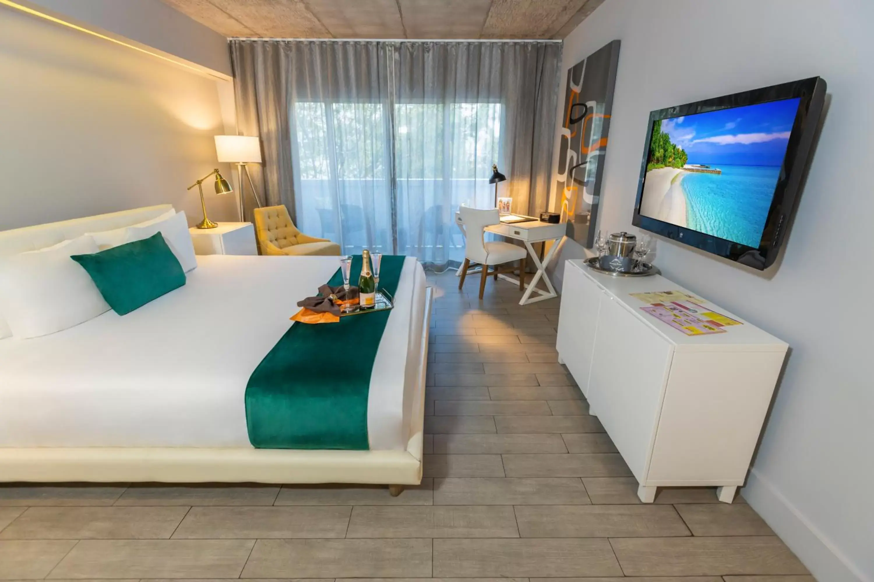 Bedroom, TV/Entertainment Center in Riviera Suites