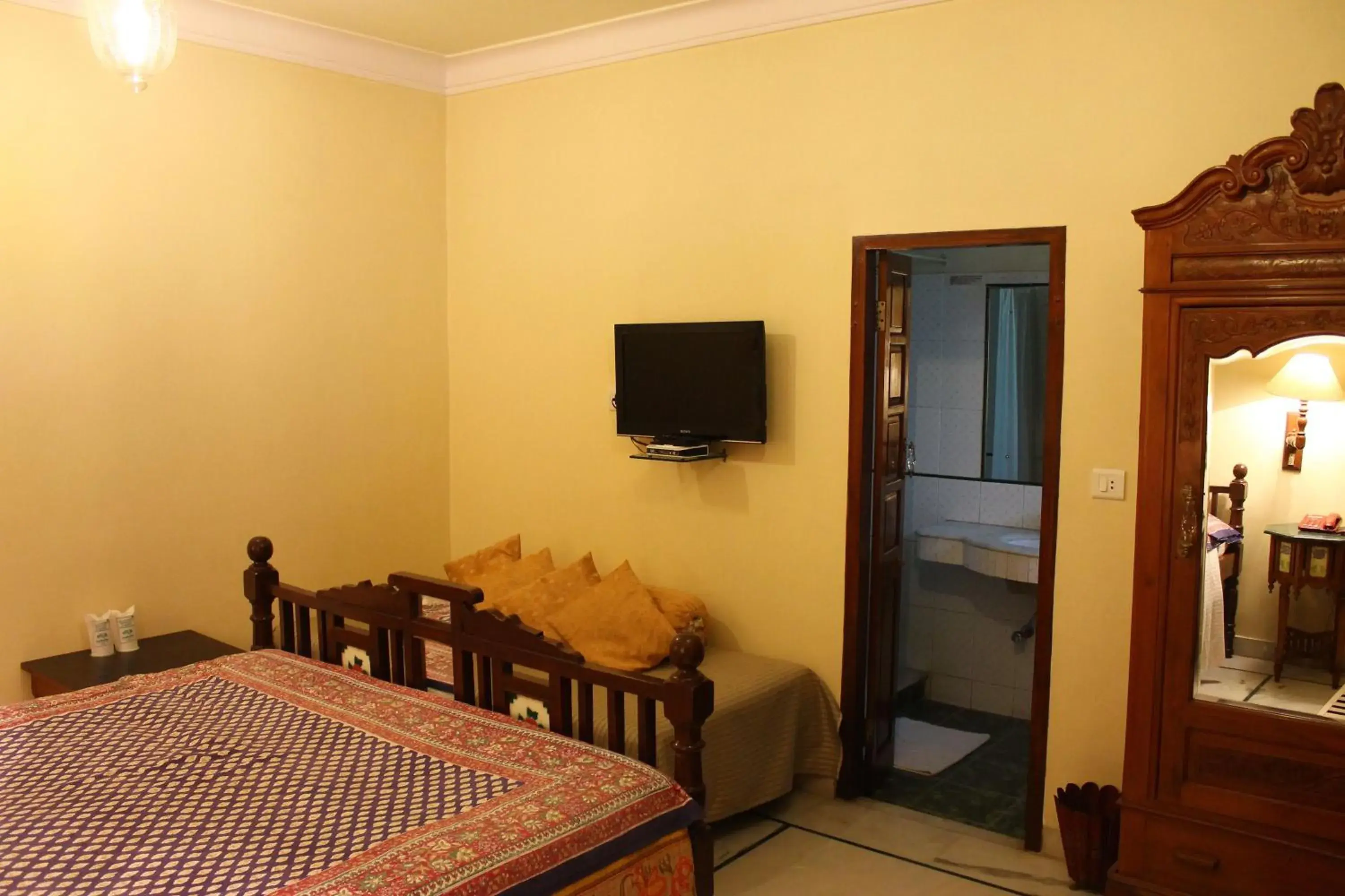 Bed, TV/Entertainment Center in Madhuban - A Heritage Home