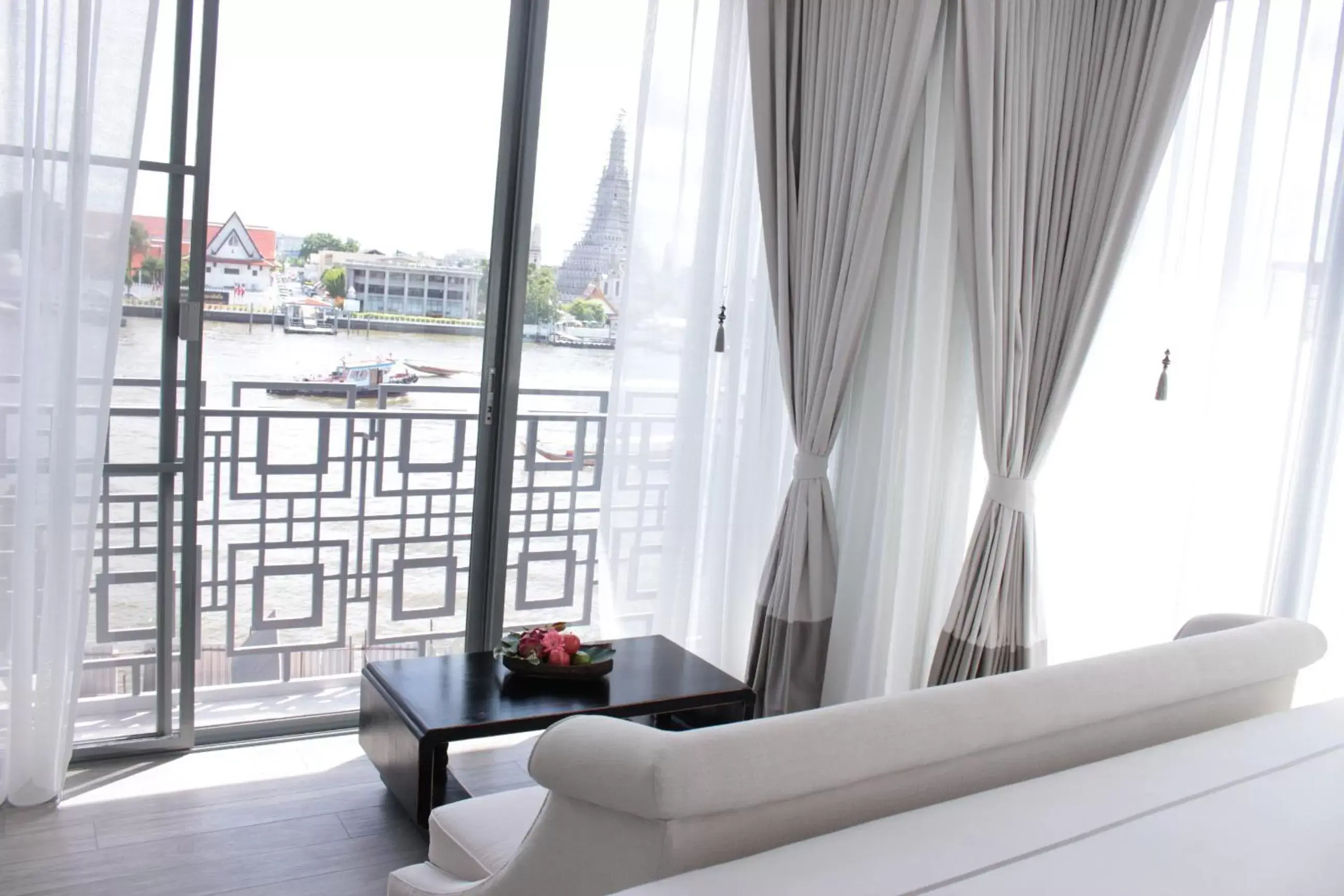 Living room in Riva Arun Bangkok - SHA Extra Plus