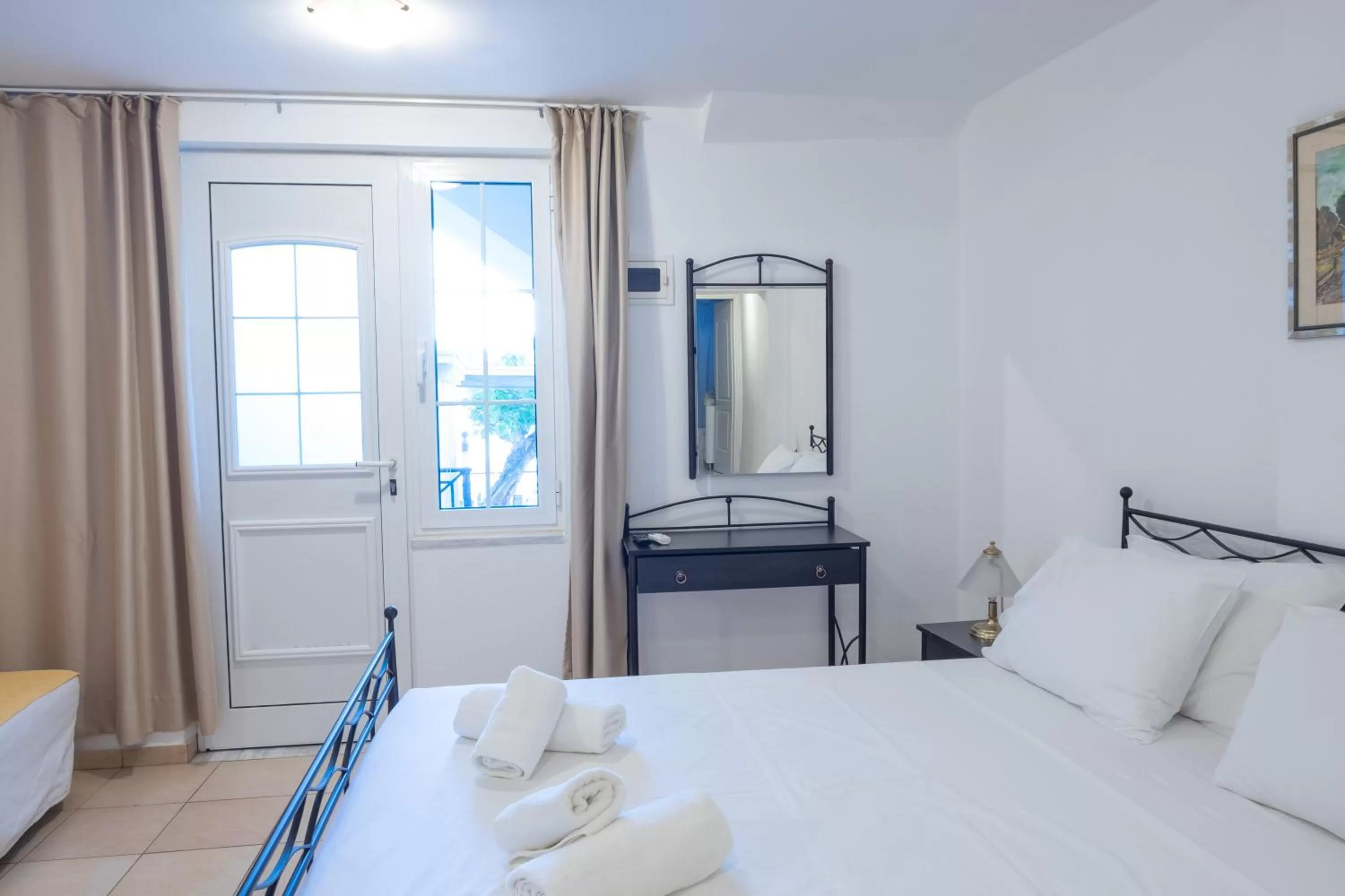 Bed in Polydoros Appartments