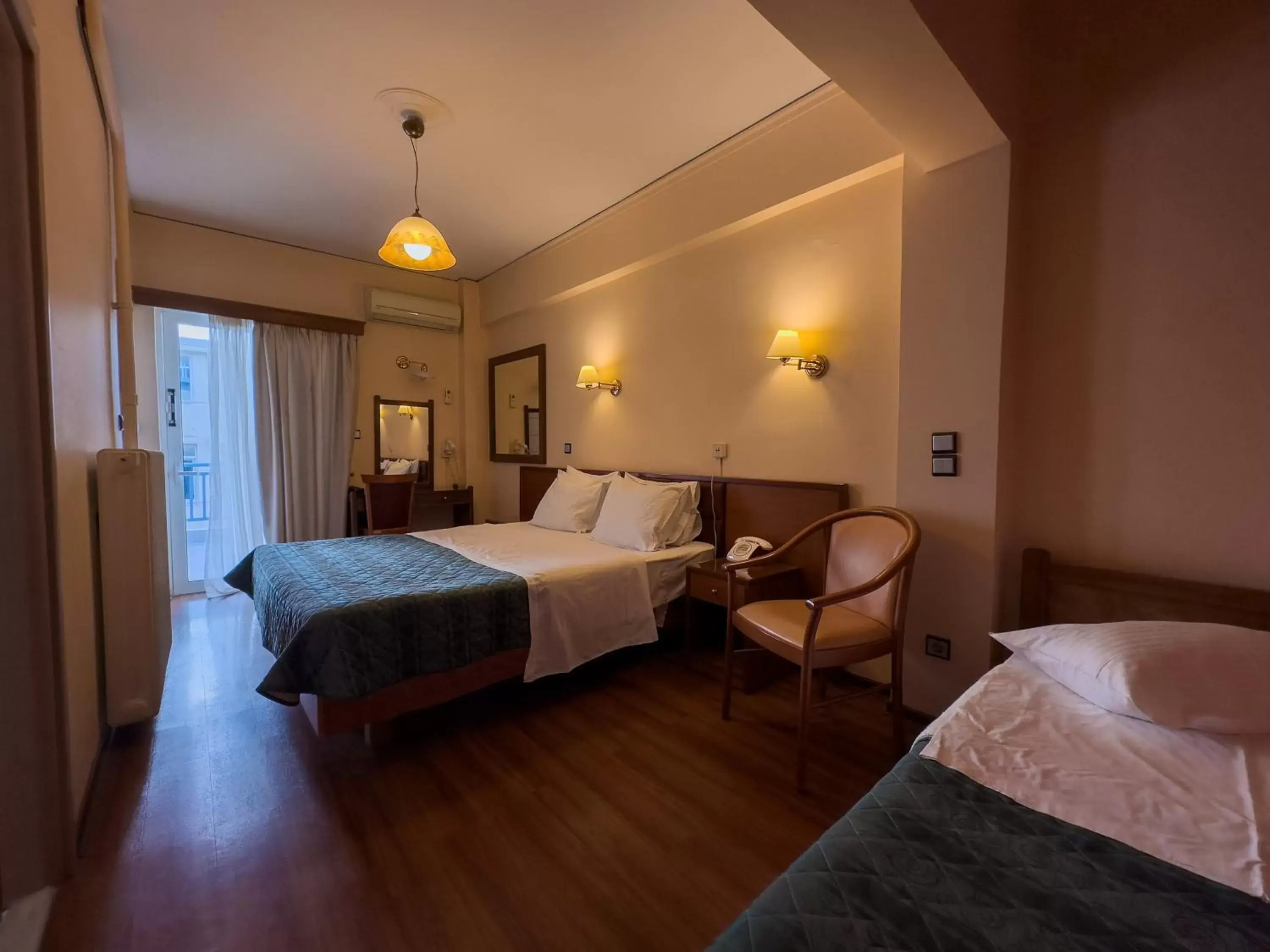 Bed in Anemoni Piraeus Hotel
