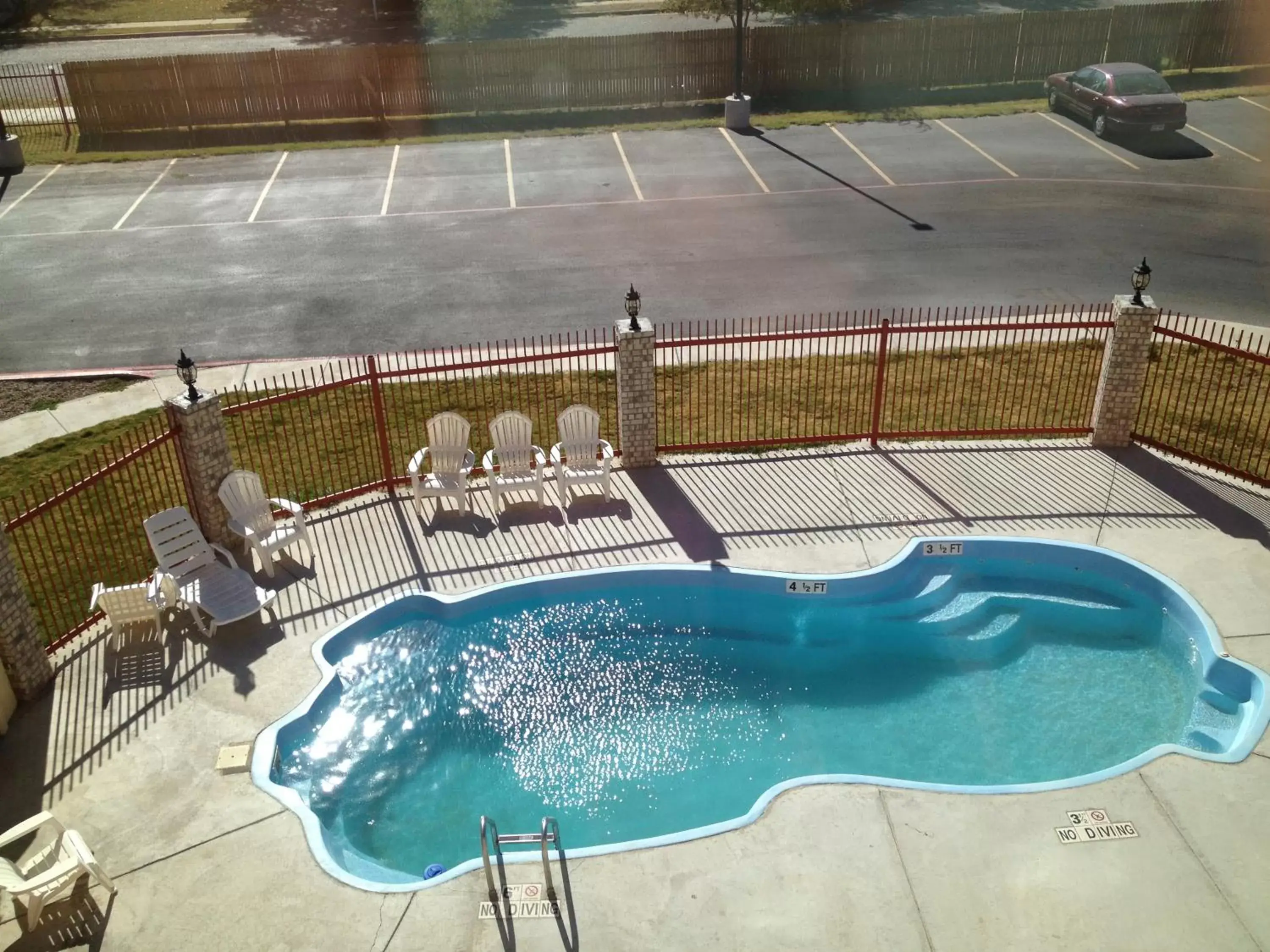 Swimming pool, Pool View in Howard Johnson by Wyndham Lubbock TX