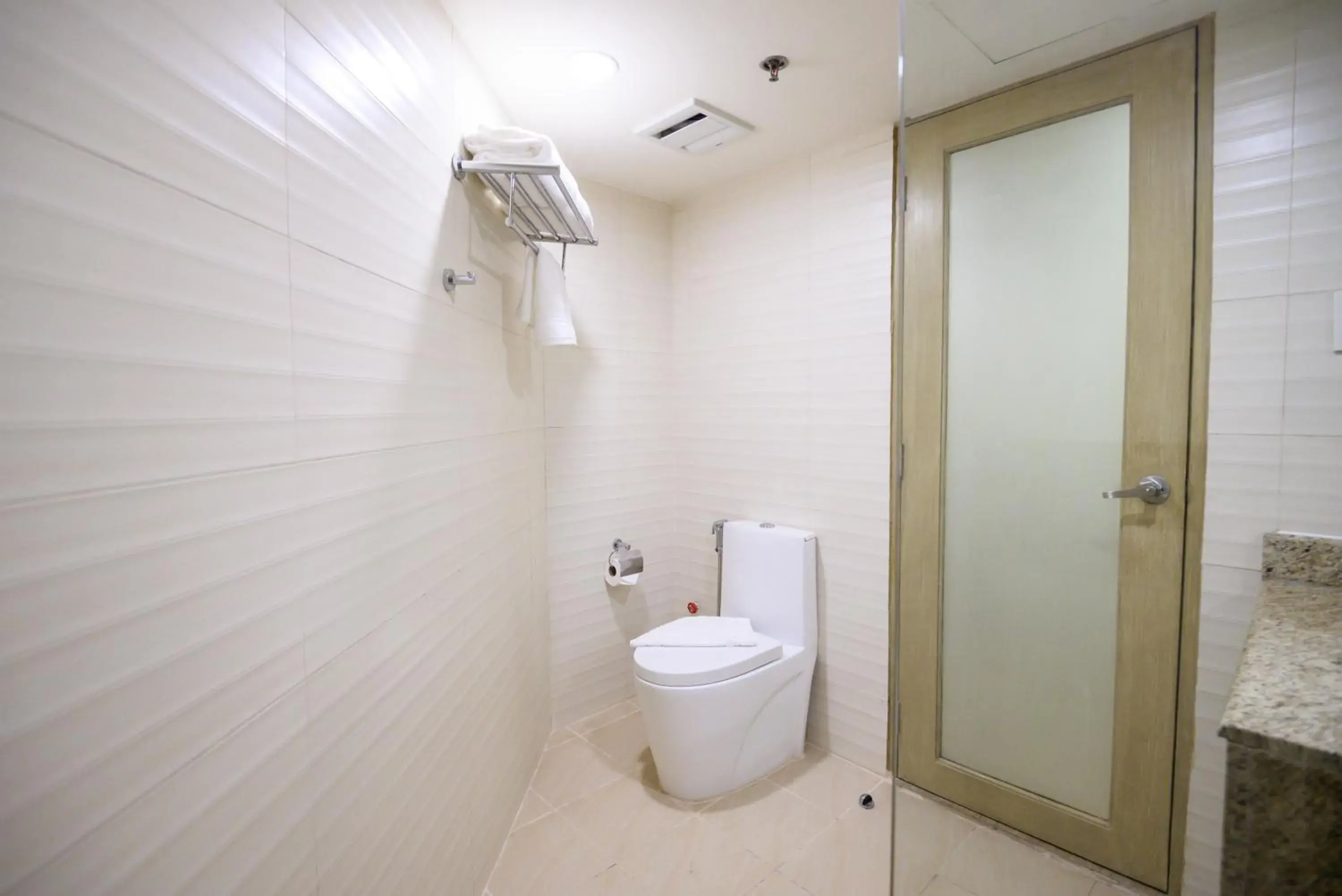 Bathroom in SureStay Plus by Best Western Cebu City