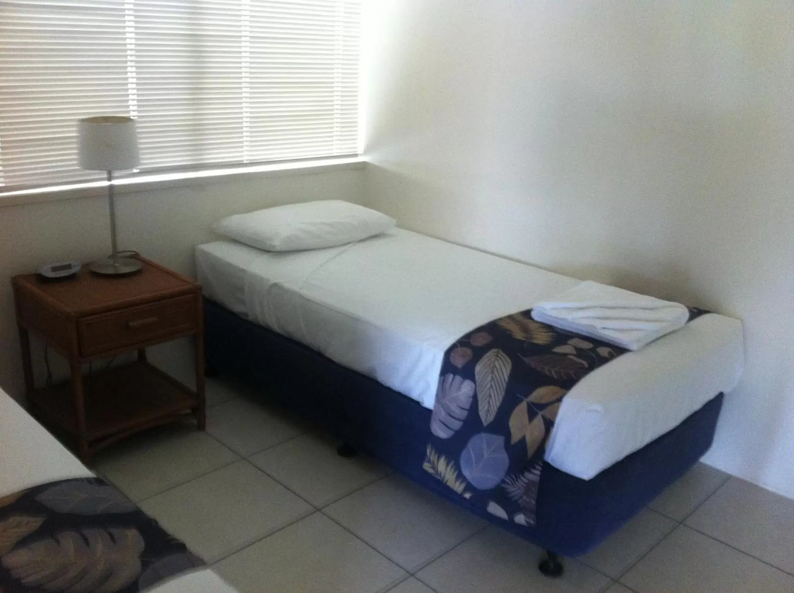 Bed in Reef Gateway Apartments