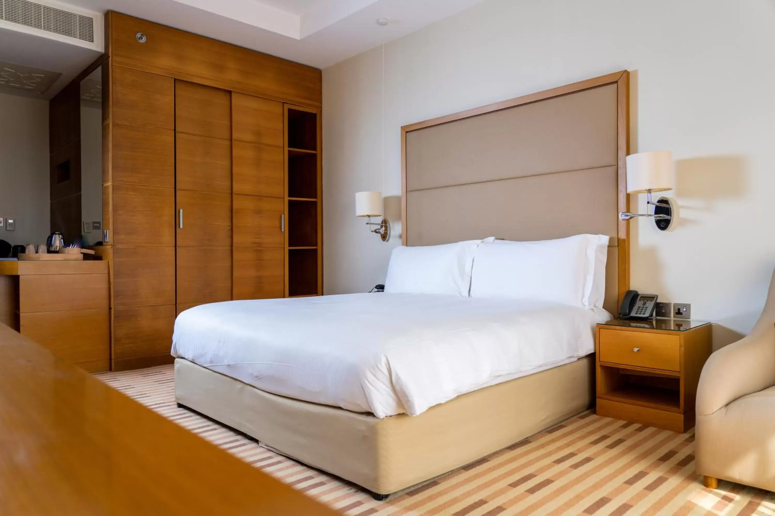 Bed in Crowne Plaza Sohar, an IHG Hotel