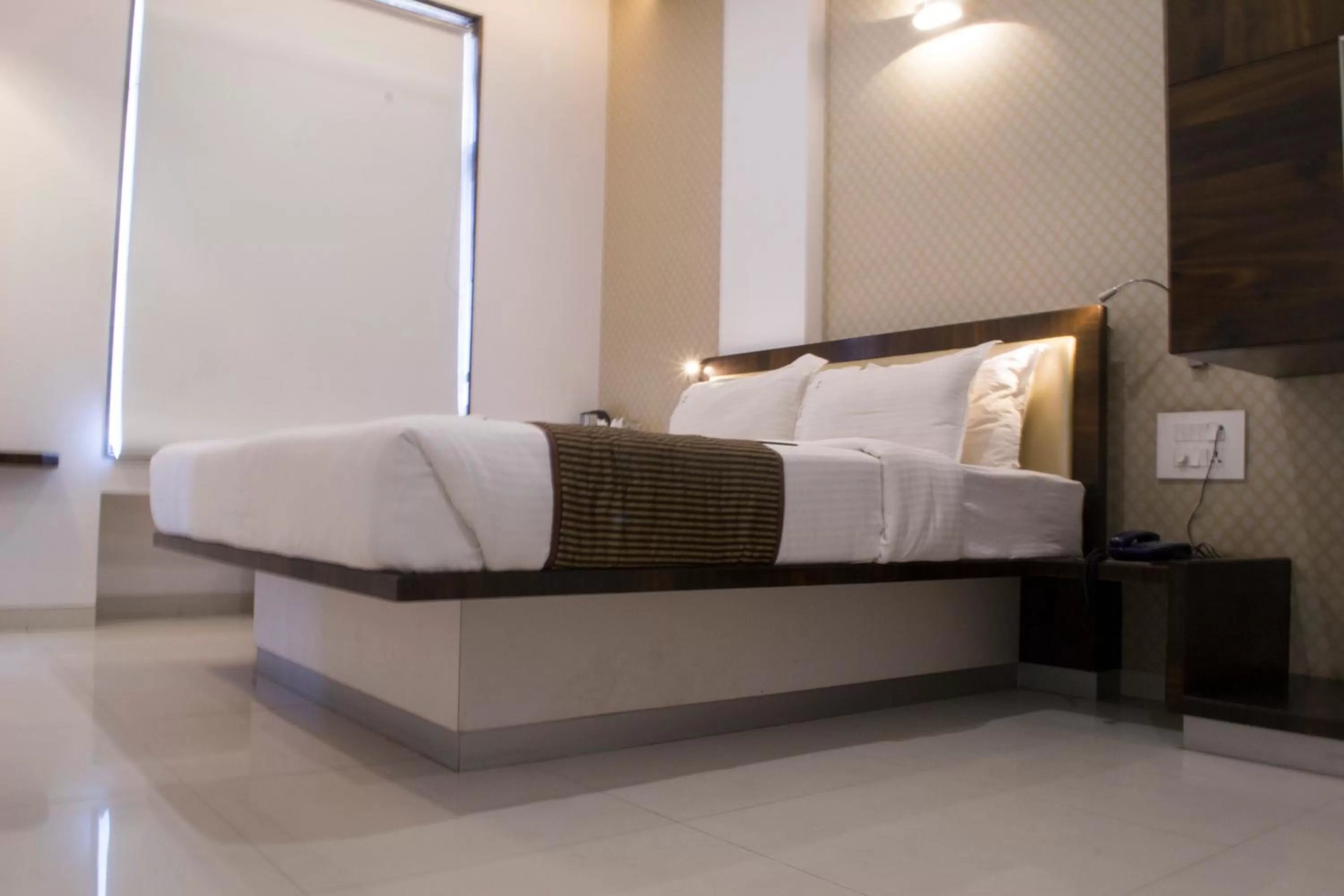 Bed in Hotel SRI SRI EXECUTIVE KOLHAPUR NEAR MAHALAXMI TEMPLE