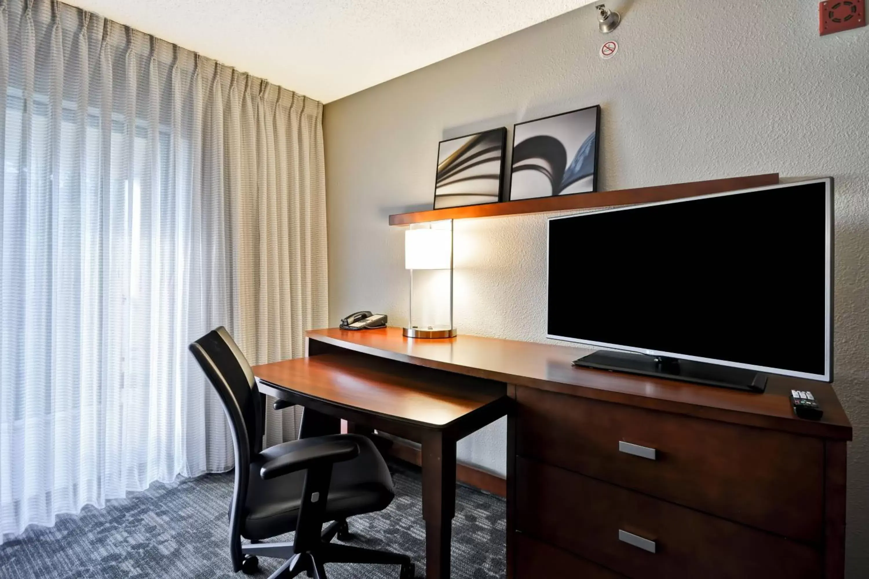 Photo of the whole room, TV/Entertainment Center in Courtyard by Marriott Jacksonville Airport/ Northeast