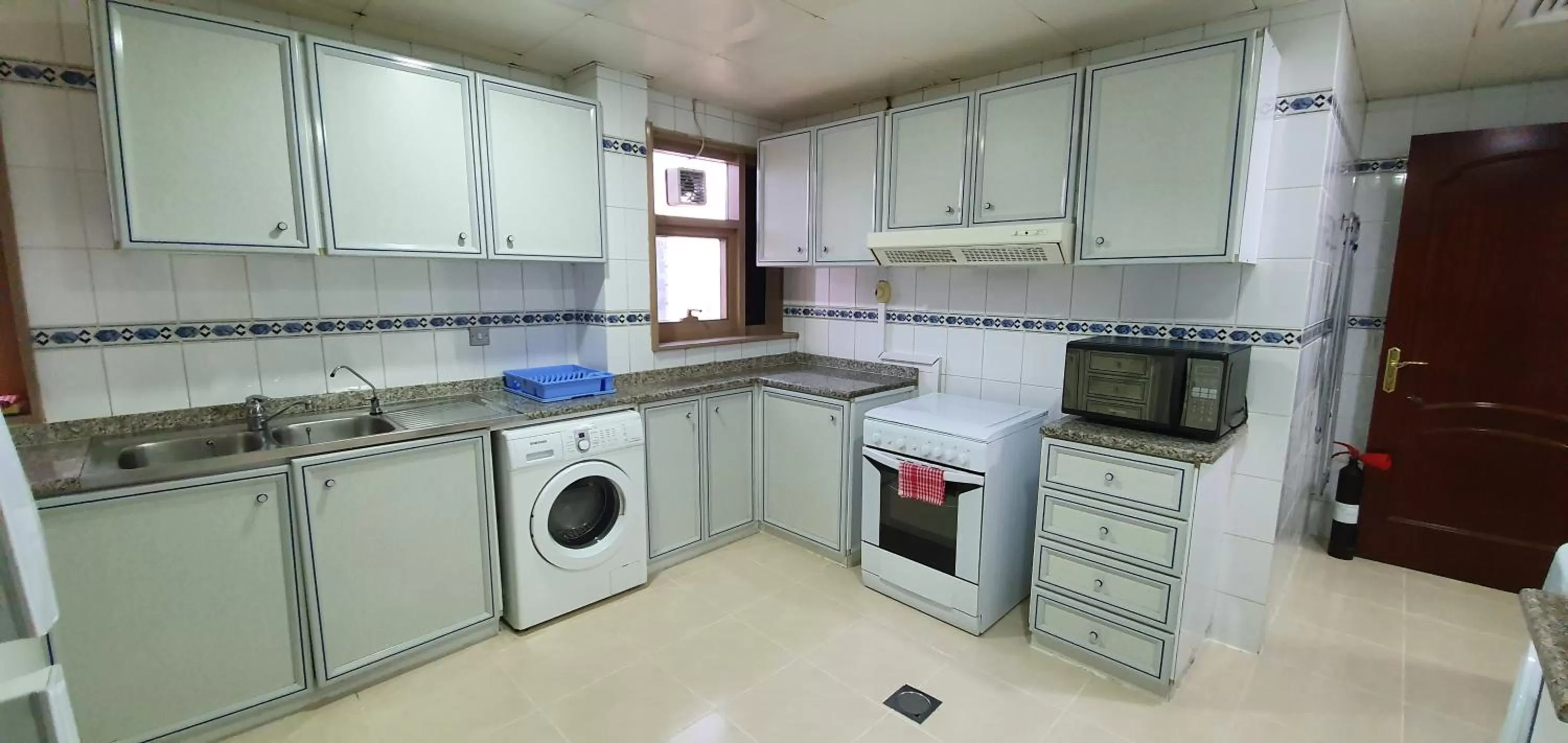 Kitchen or kitchenette in Ivory Hotel Apartments