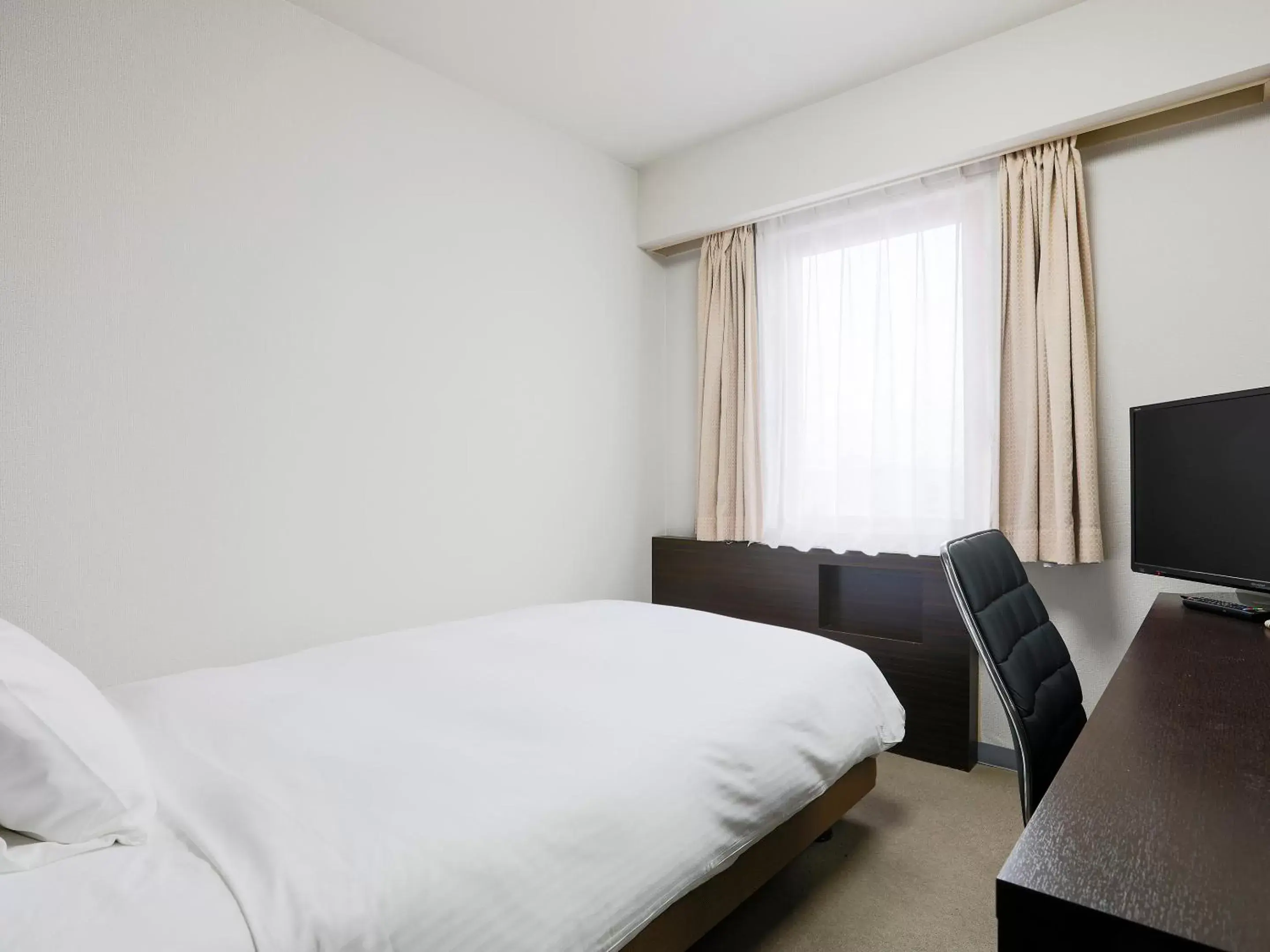 Bed in Hotel Wing International Miyakonojo