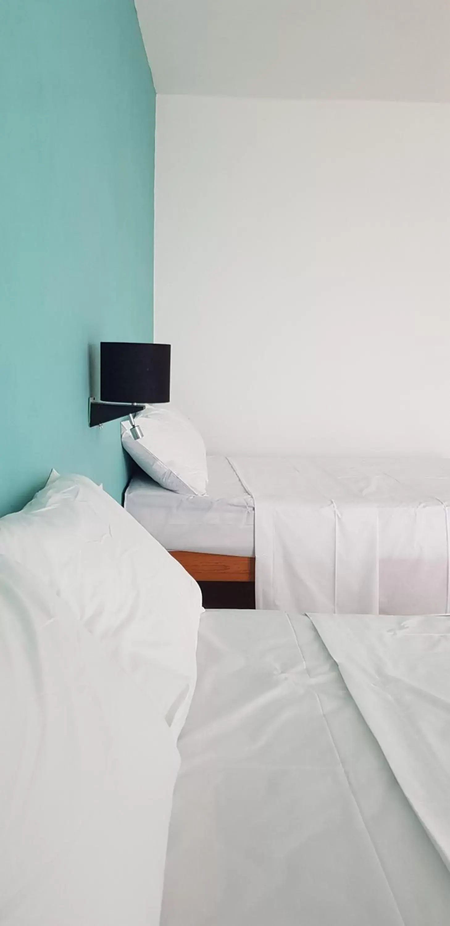 Bed in Hotel Paso del Mar