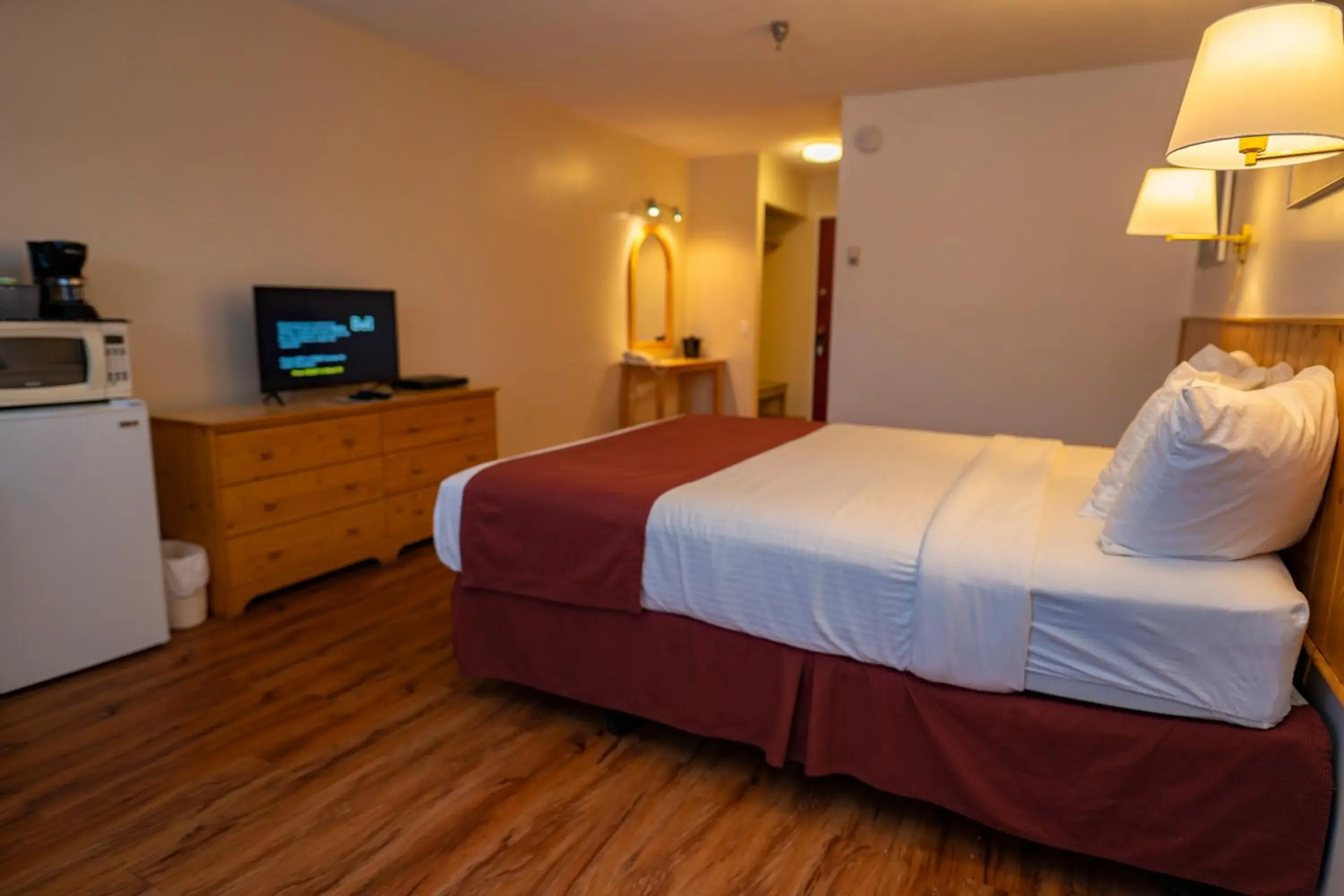 Bed in Canadas Best Value Inn- River View Hotel