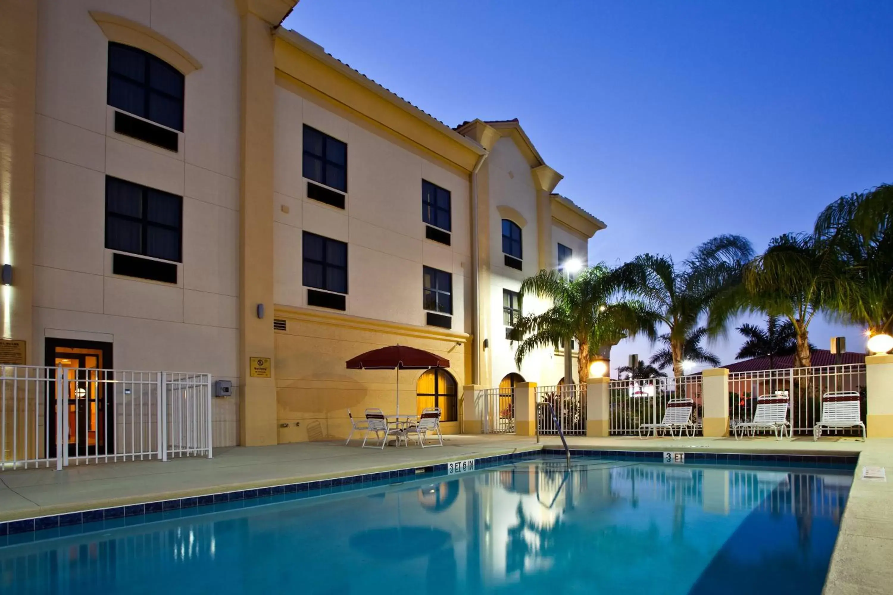 Swimming pool, Property Building in Holiday Inn Express Stuart, an IHG Hotel