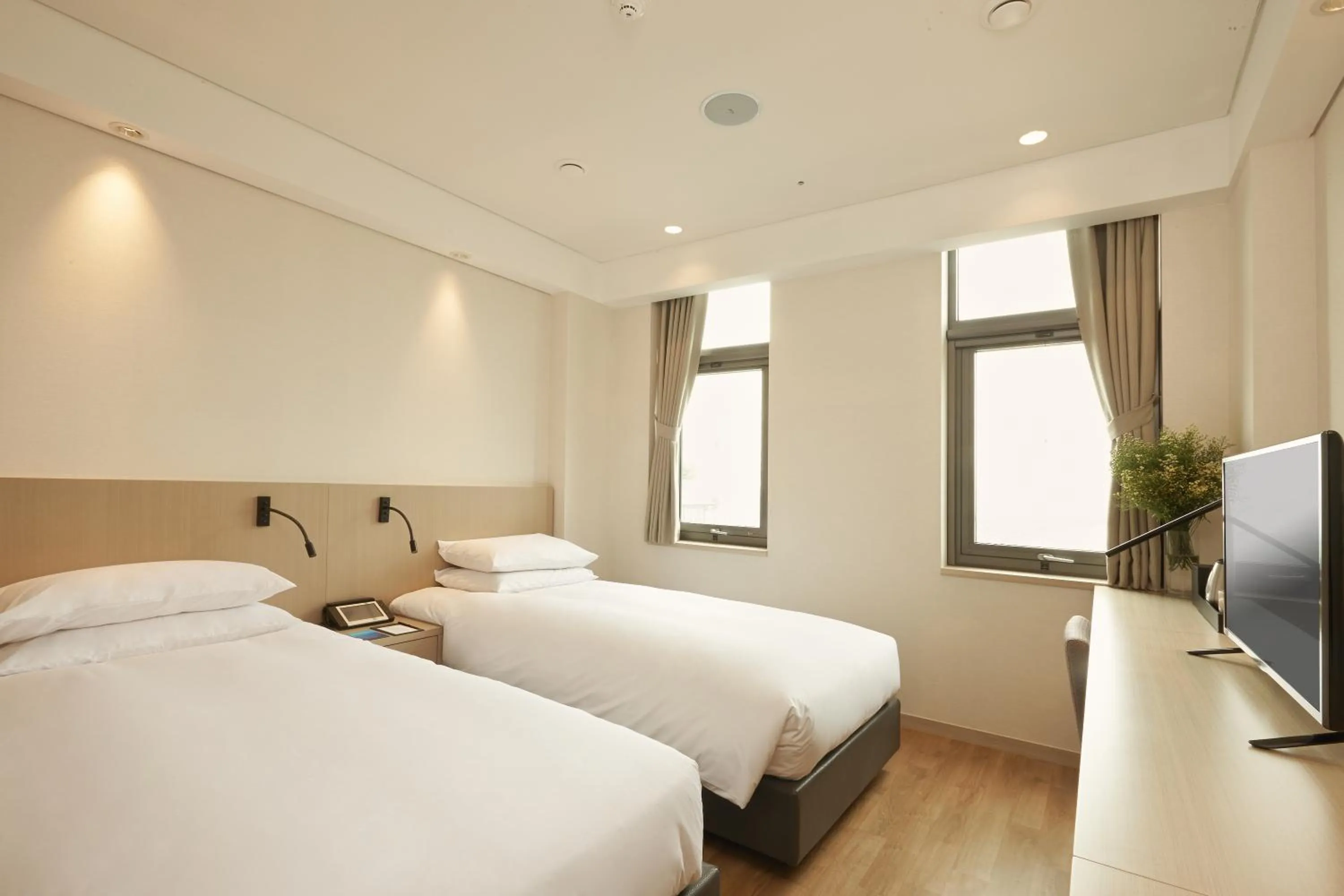 Bed in Mayplace Hotel