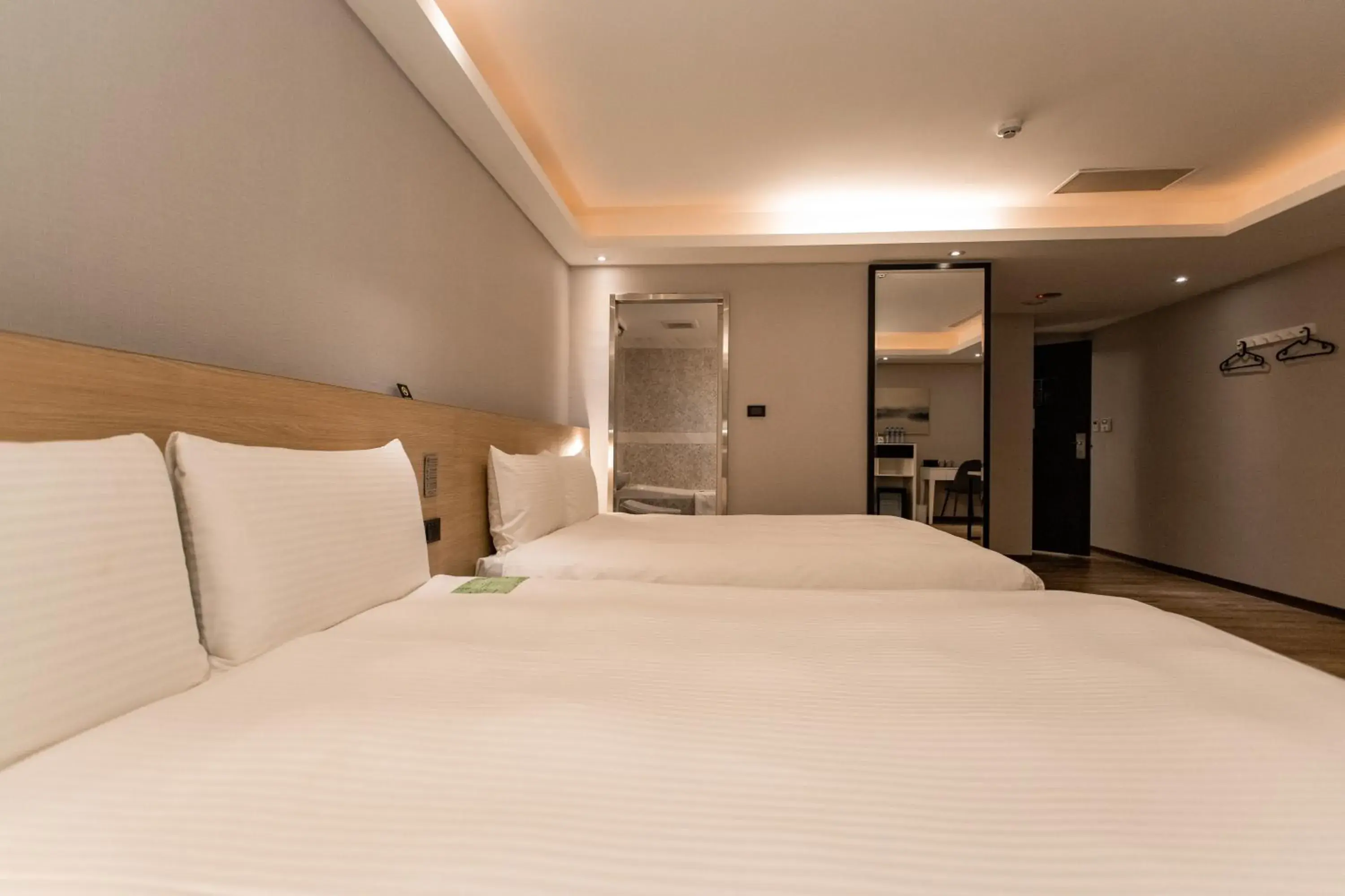 Bed in Hub Hotel Tucheng