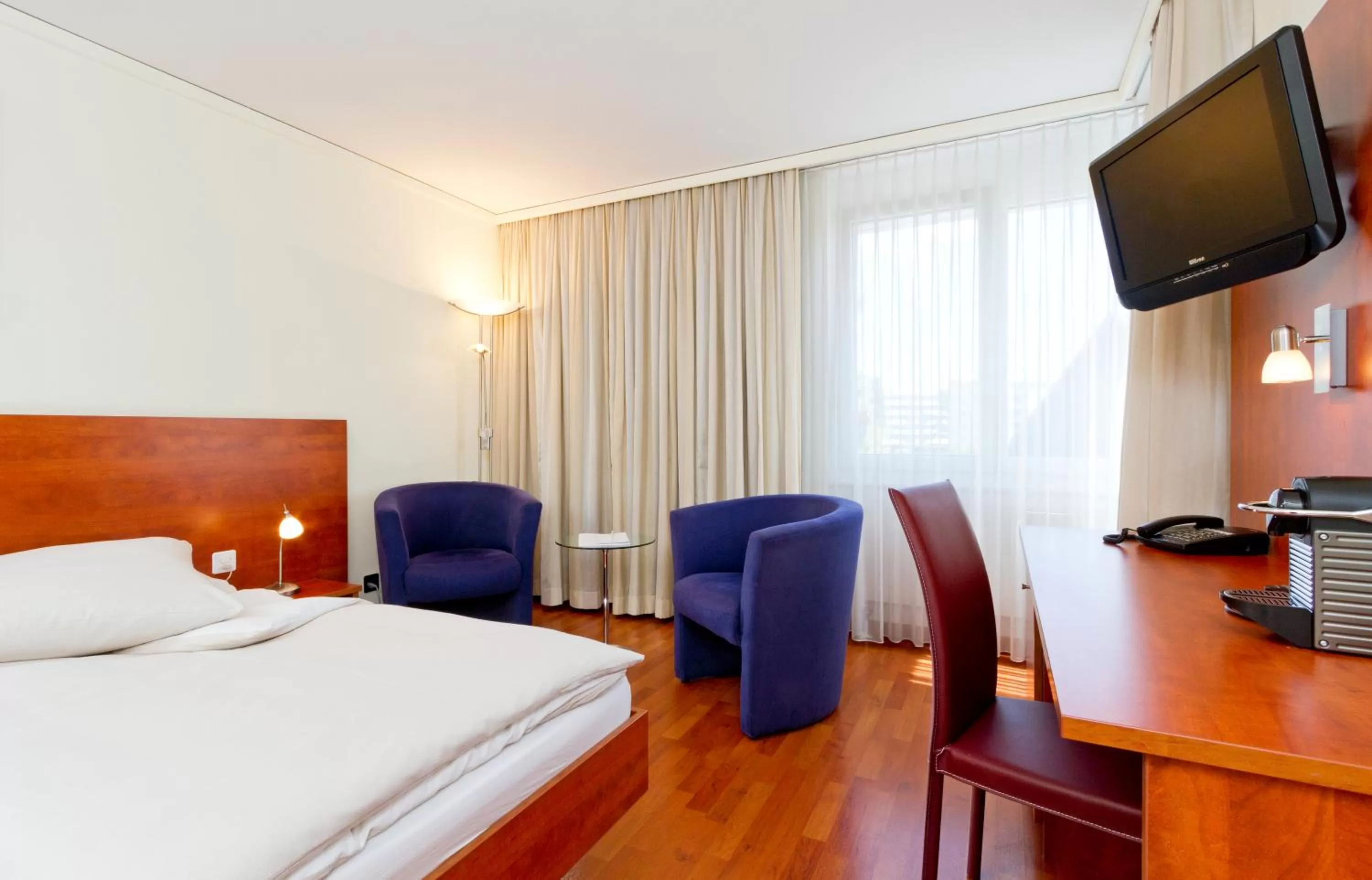 Photo of the whole room, Bed in Sorell Hotel Sonnental Dübendorf