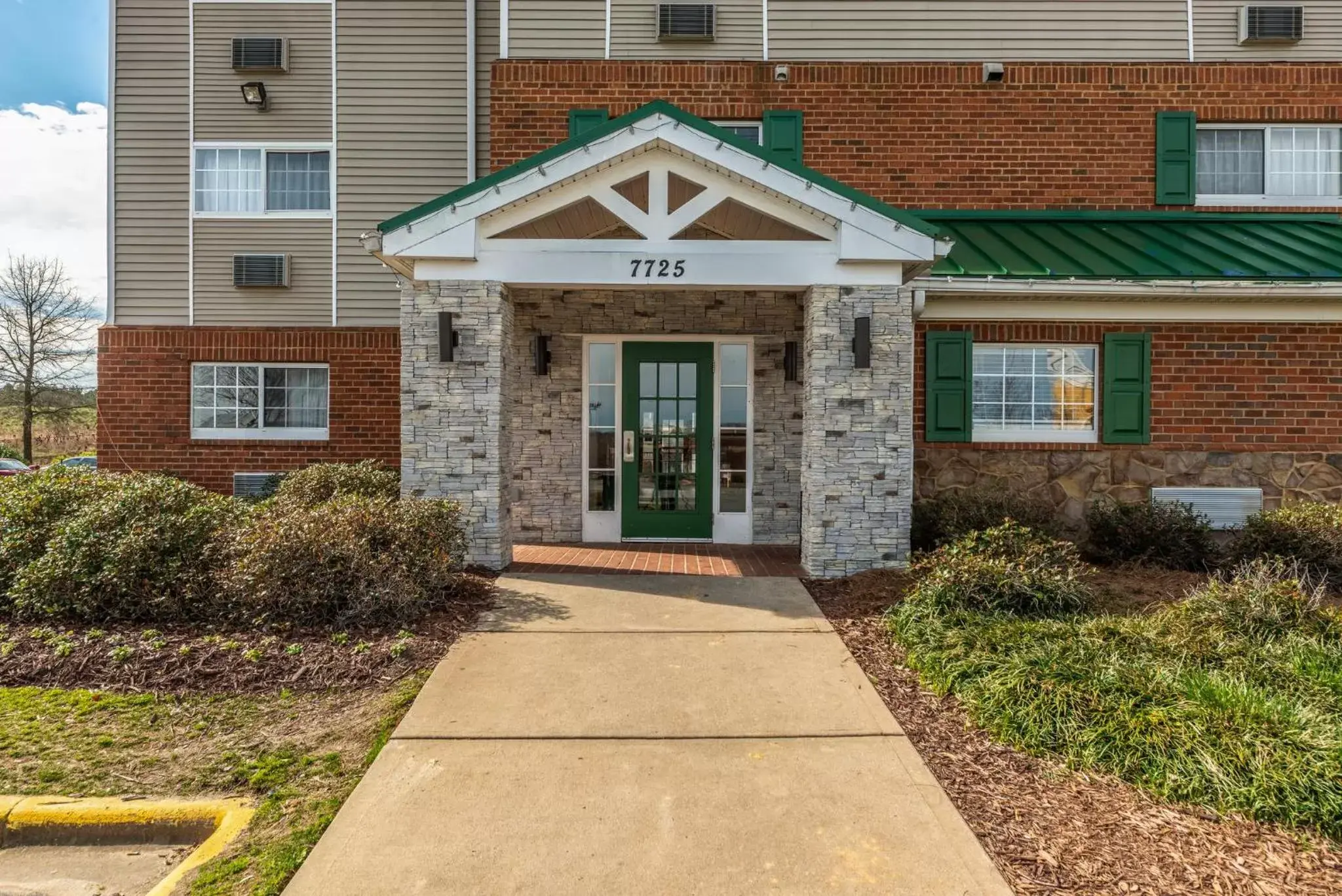 Property building in HomeTowne Studios & Suites by Red Roof Charlotte - Concord