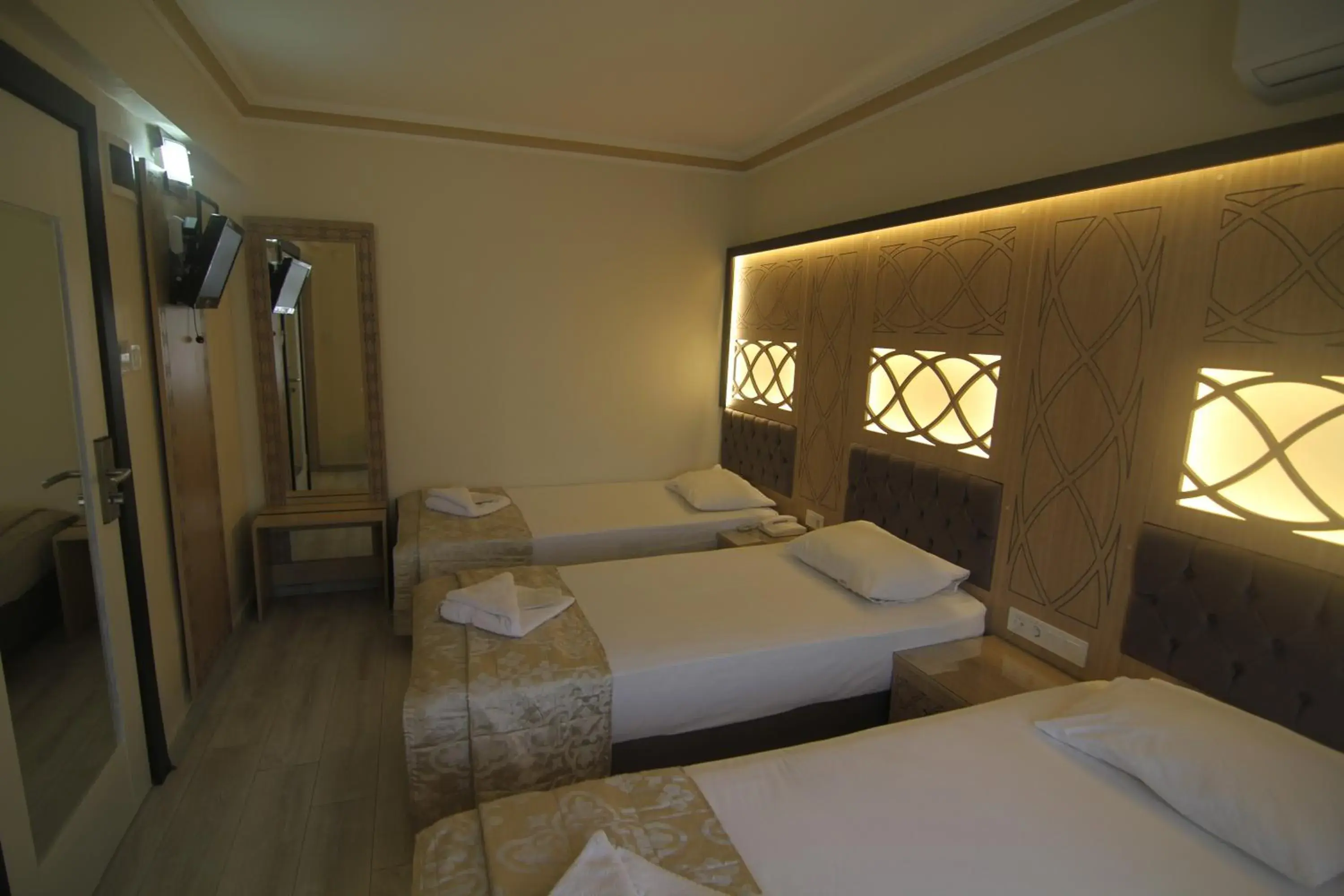 Bed in Grand Liza Hotel
