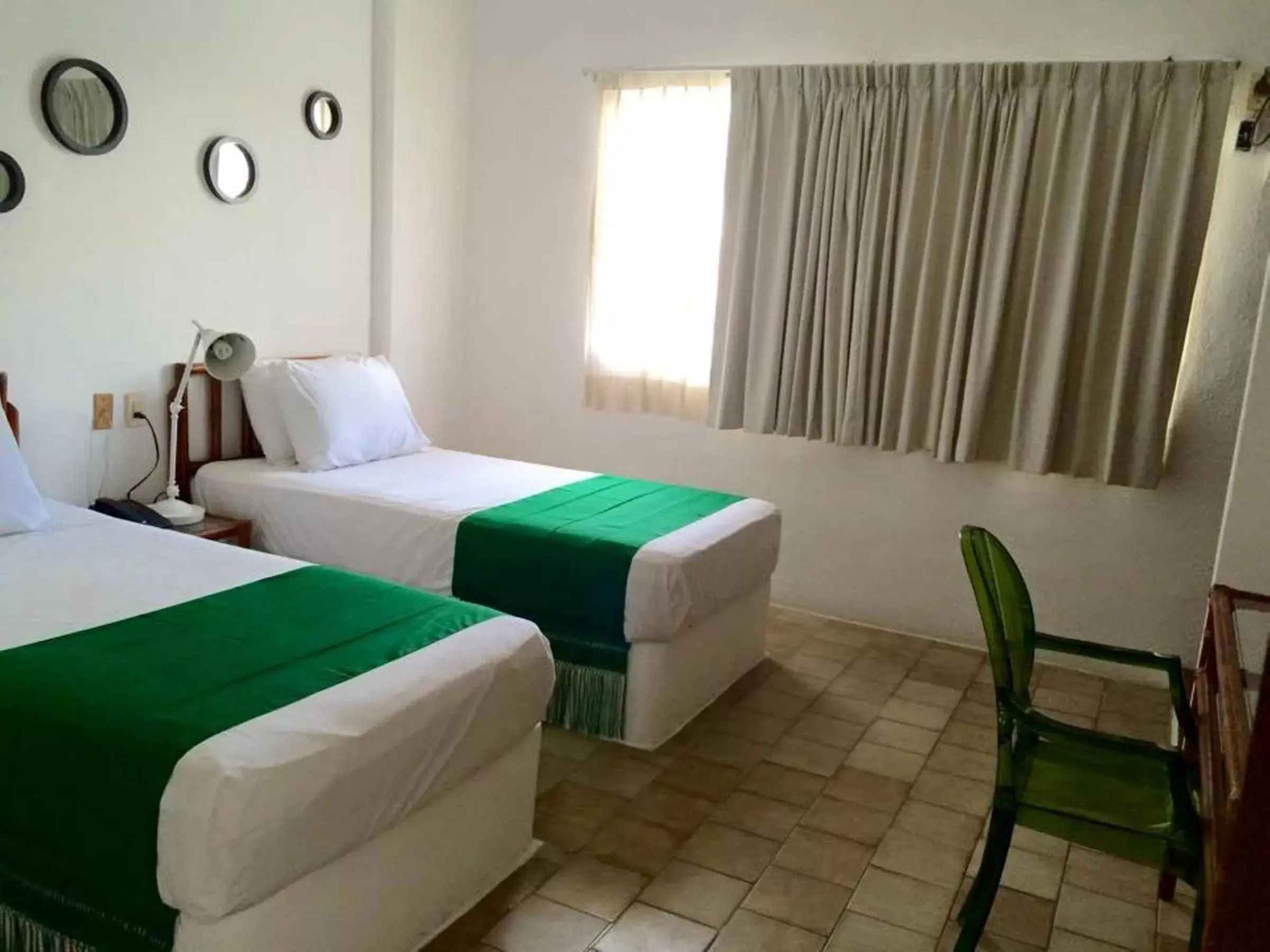 Bed in Emperador Vallarta Beachfront Hotel and Suites
