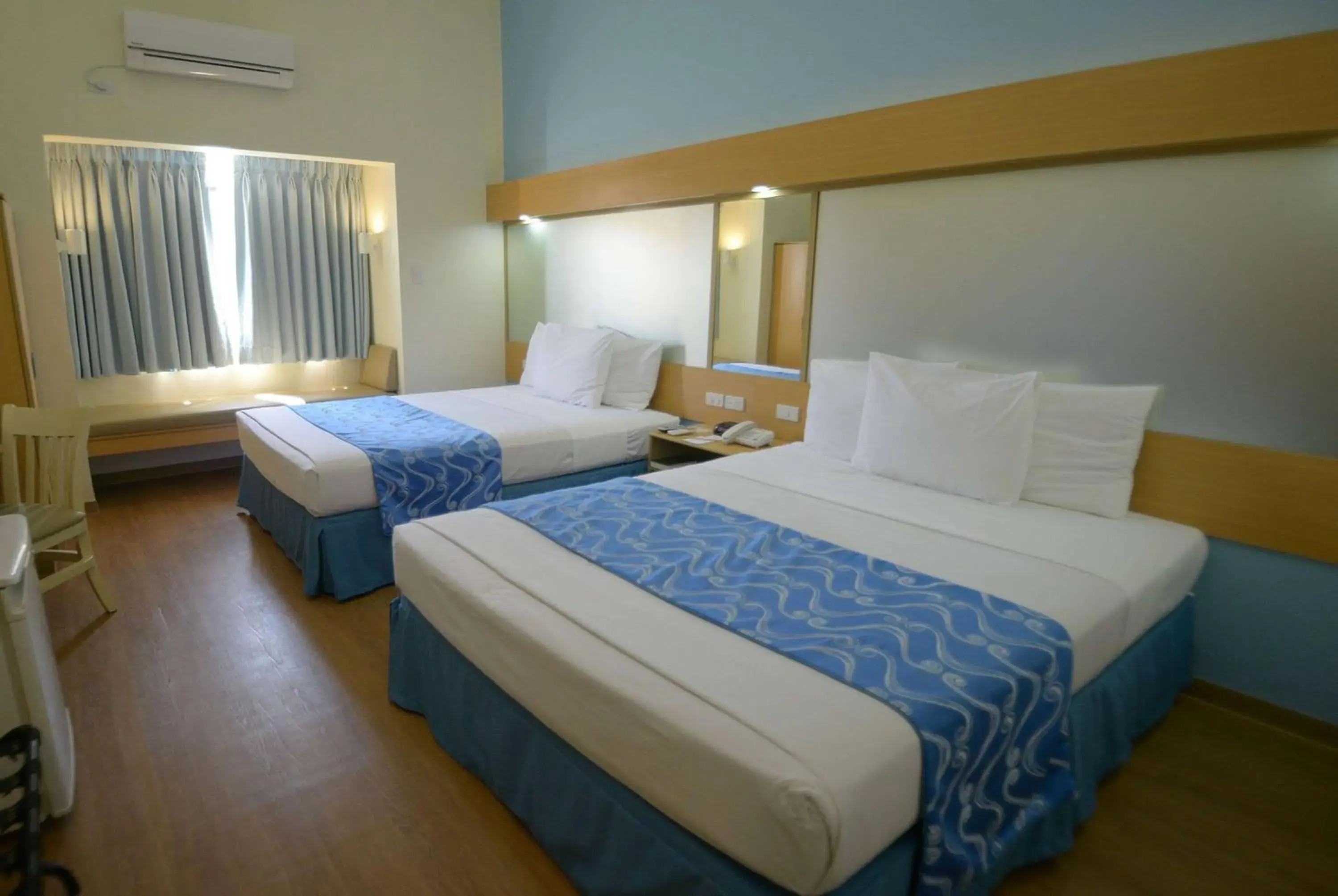 Photo of the whole room, Bed in Microtel by Wyndham Davao