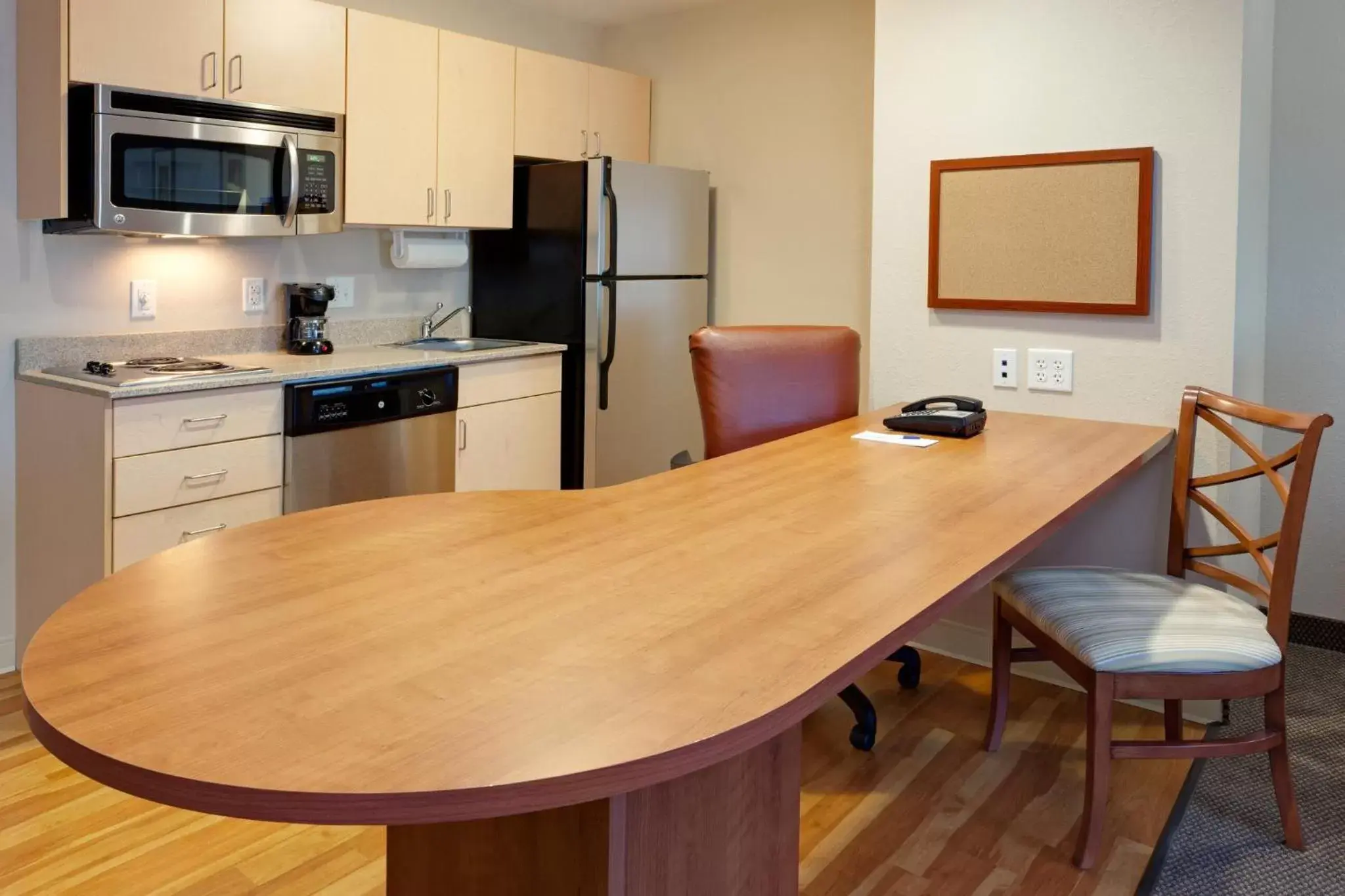 Photo of the whole room, Kitchen/Kitchenette in Candlewood Suites Watertown Fort Drum, an IHG Hotel