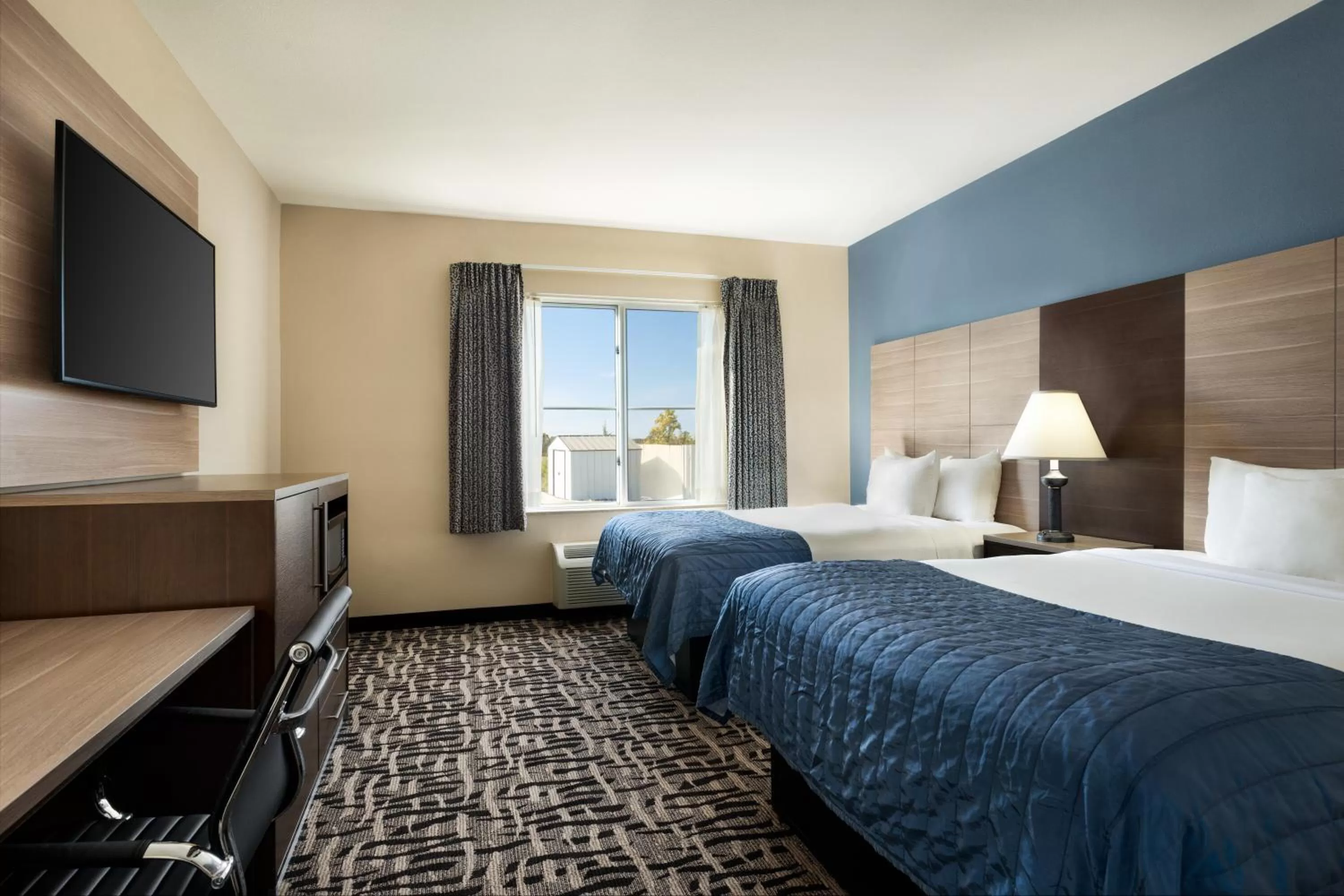 Photo of the whole room, Bed in Baymont by Wyndham Ft. Leonard/Saint Robert