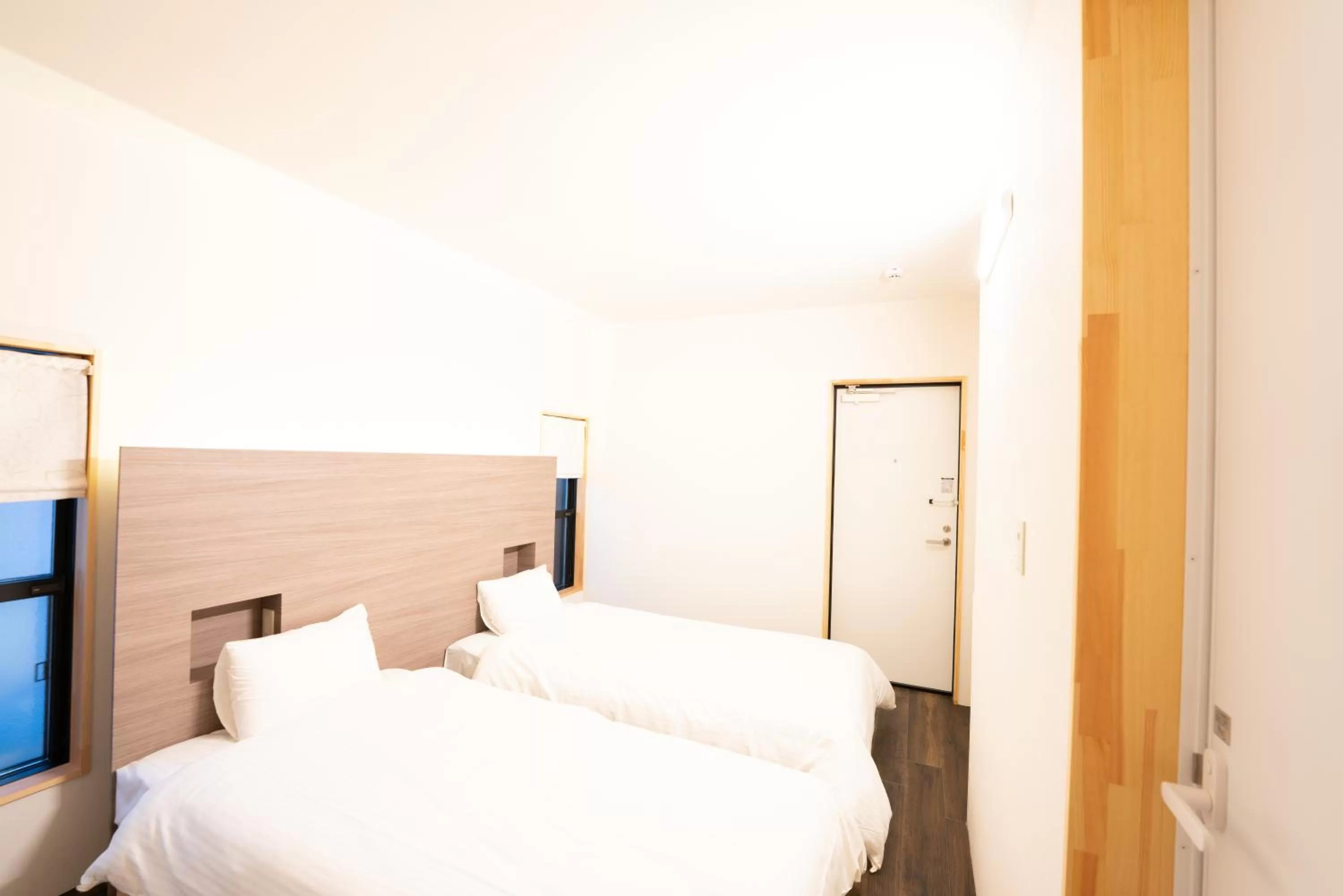 Bed in B&B MIKAWA Info Centre - Kanazawa Fish Harbour