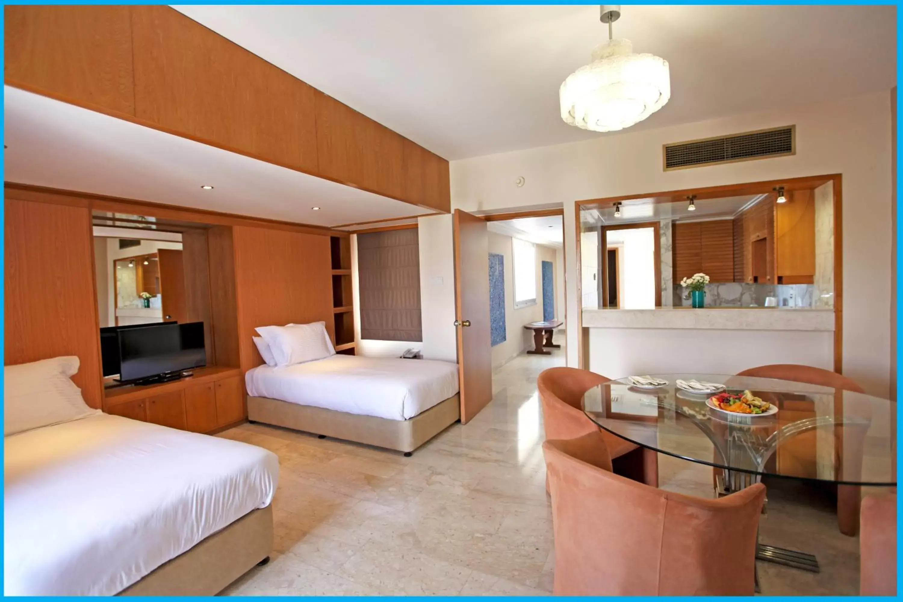 Bed in Poseidonia Beach Hotel