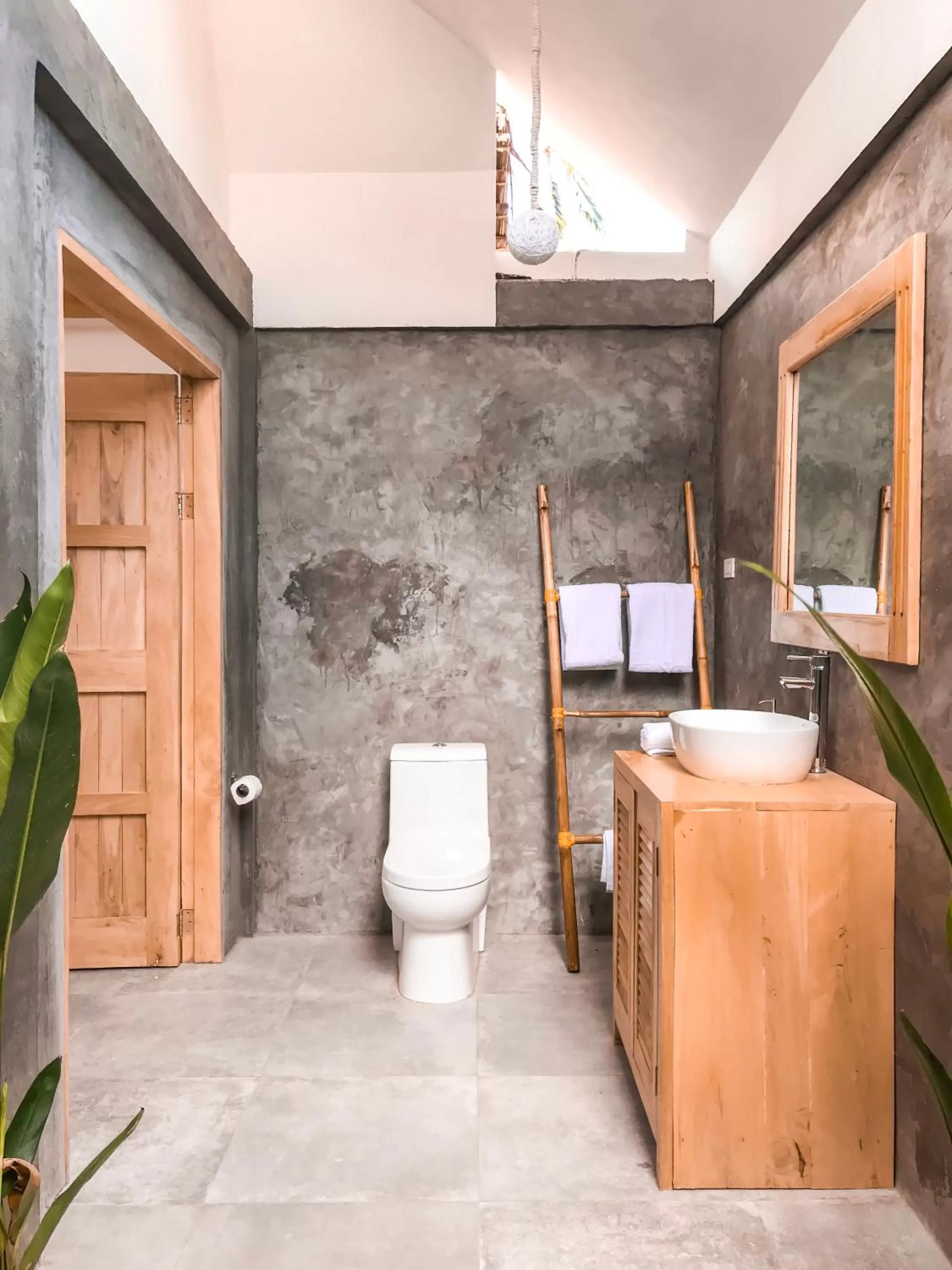 Toilet in Bermuda Triangle Bungalows