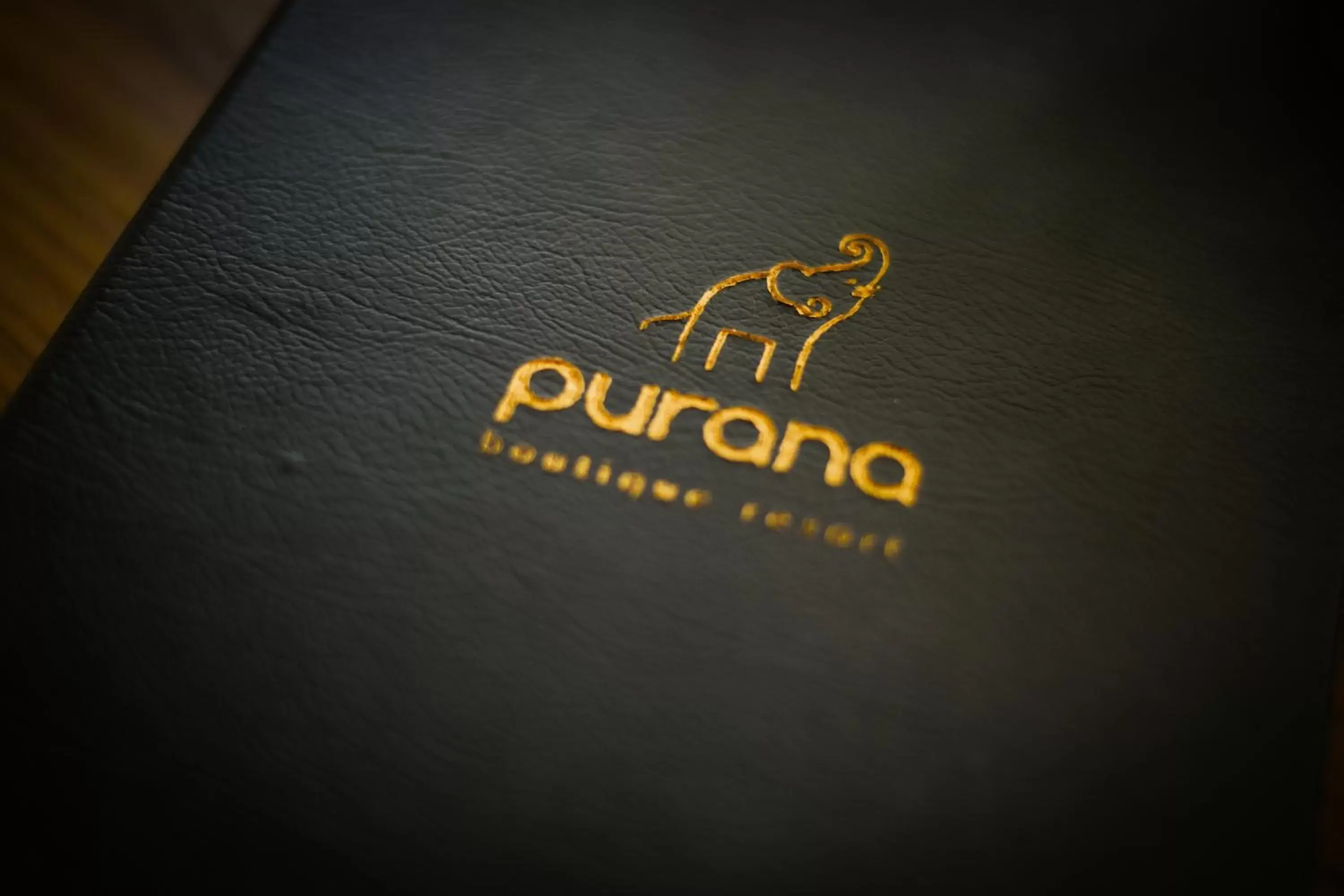 Property logo or sign in Purana Boutique Resort