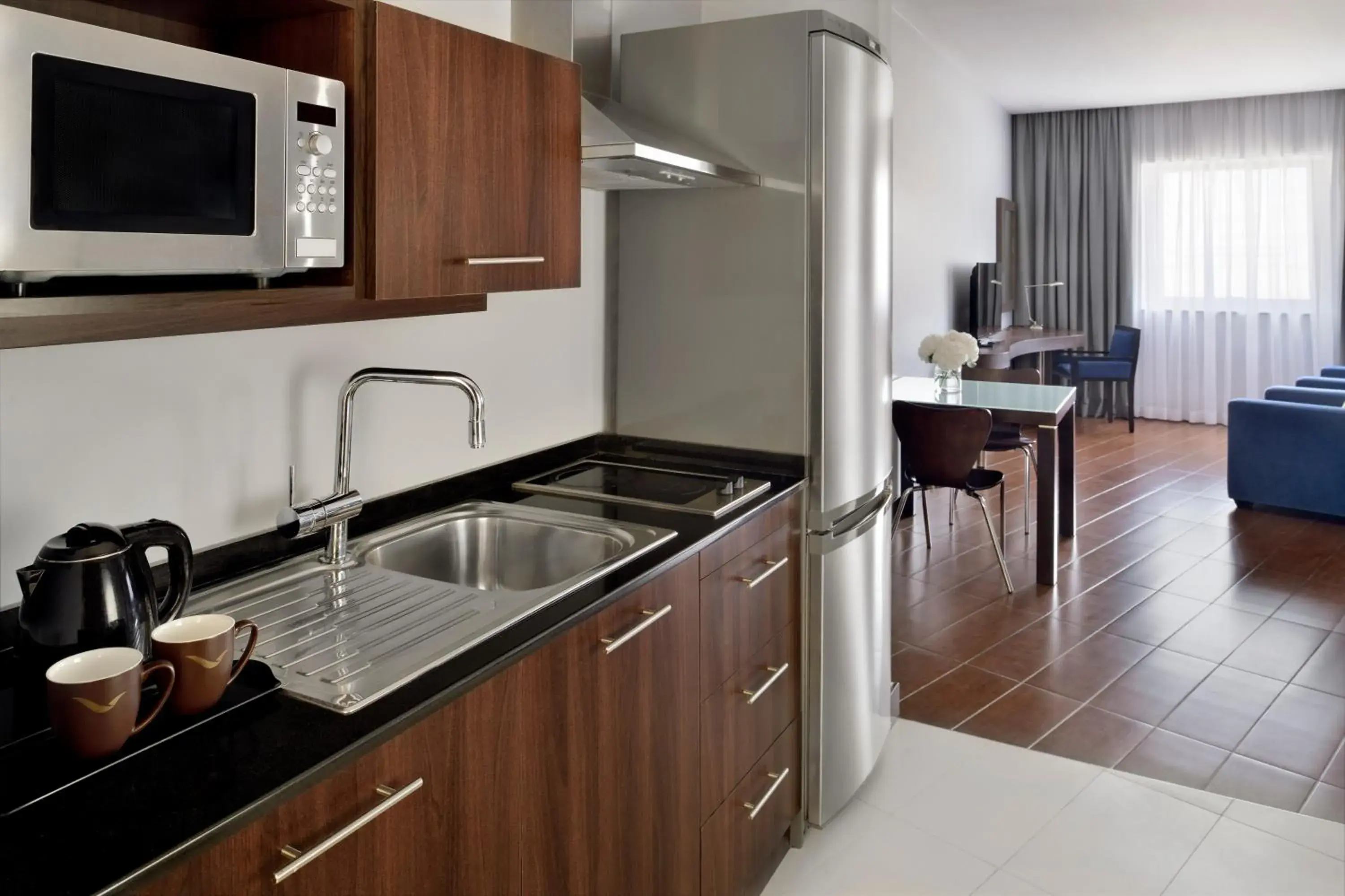 TV and multimedia, Kitchen/Kitchenette in Moevenpick Hotel Apartments The Square