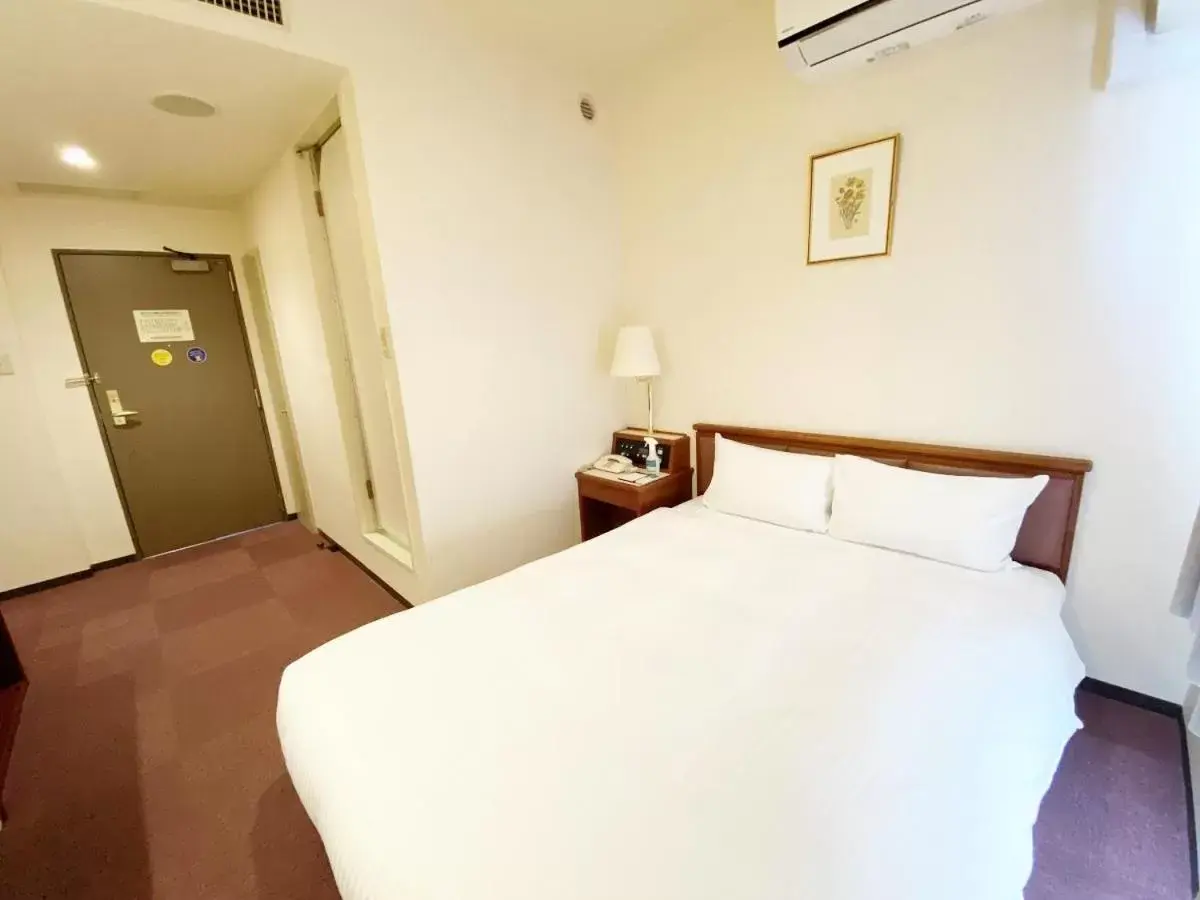 Bed in Smile Hotel Kitaasaka