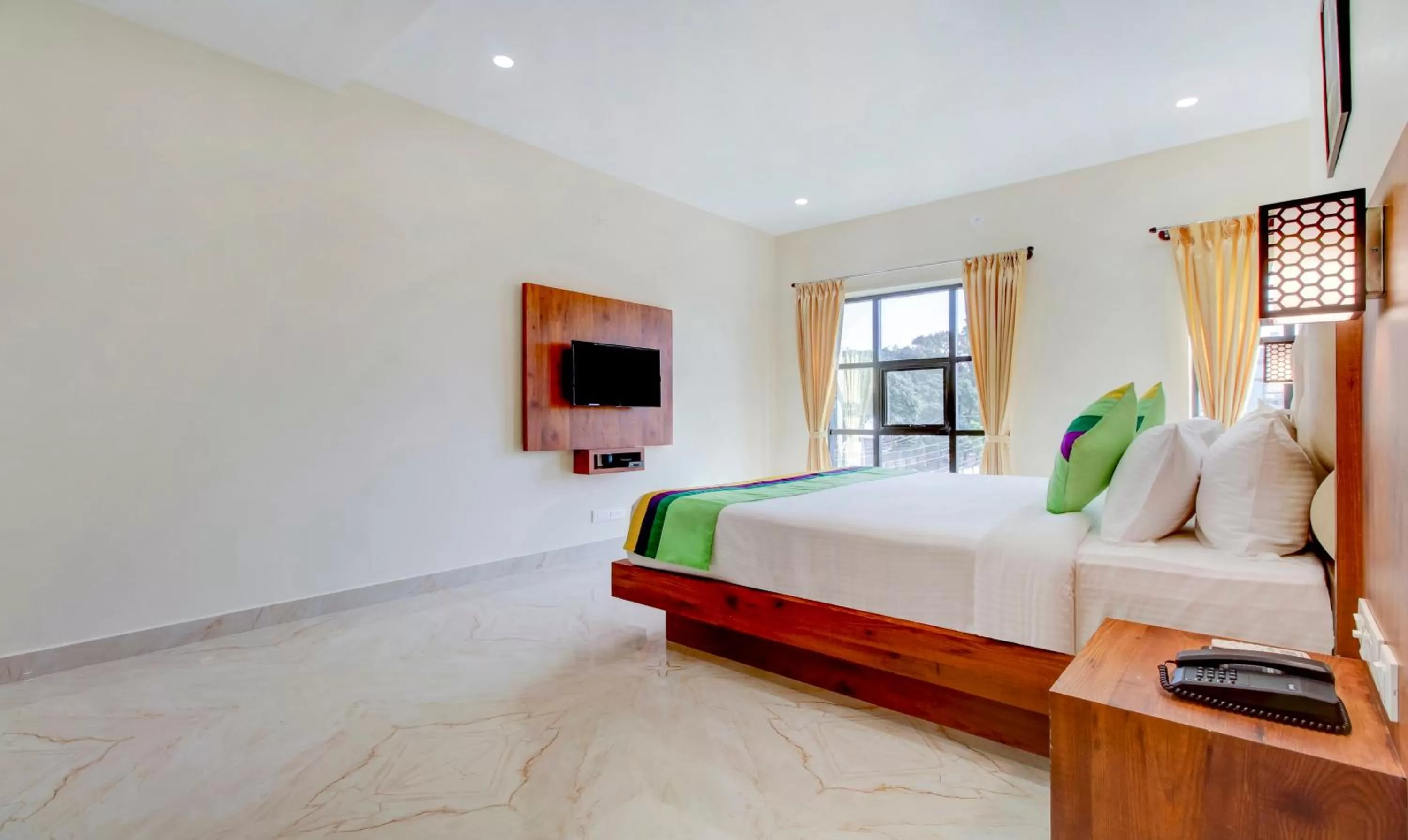 Bedroom, Bed in Treebo The Meridian