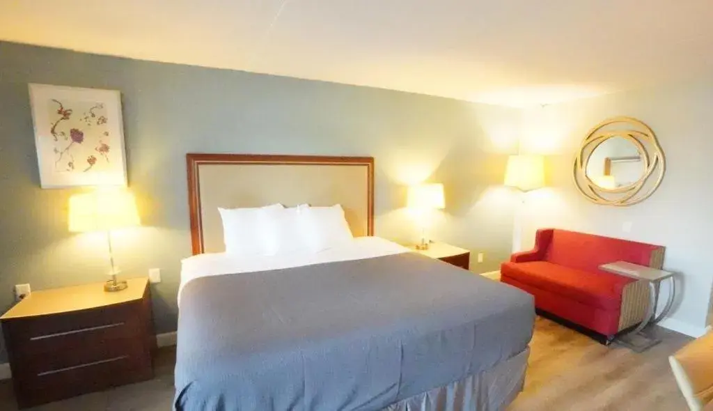 Bed in All Seasons Inn & Suites Bed in All Seasons Inn & Suites